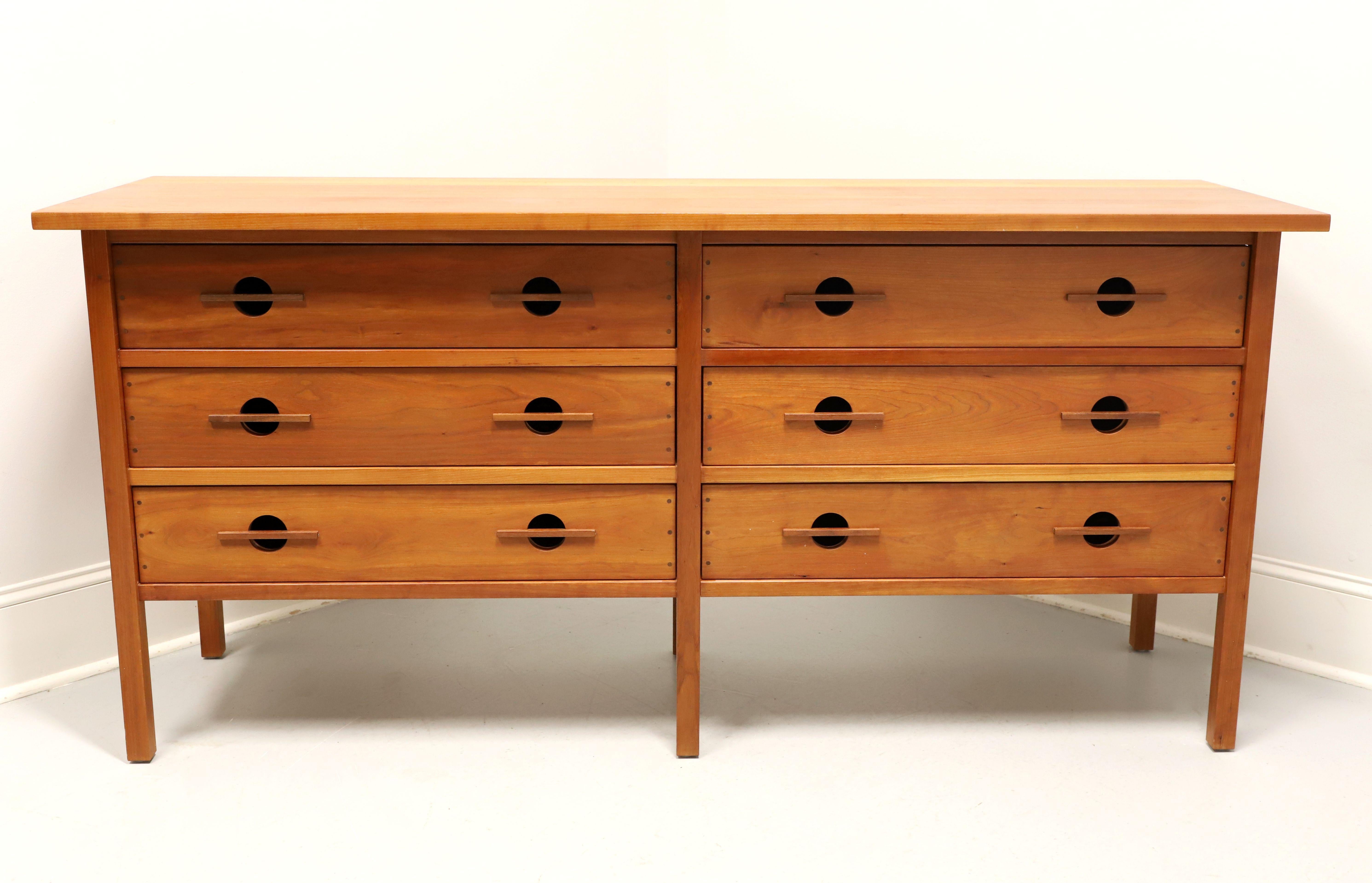 A Mission / Arts & Crafts style double dresser by John Kelly Furniture, the J-29 Longboy, from their J1 Series. Solid black cherry with black walnut peg detailing to drawers, square edge overhanging top, signature exposed structural frame, and