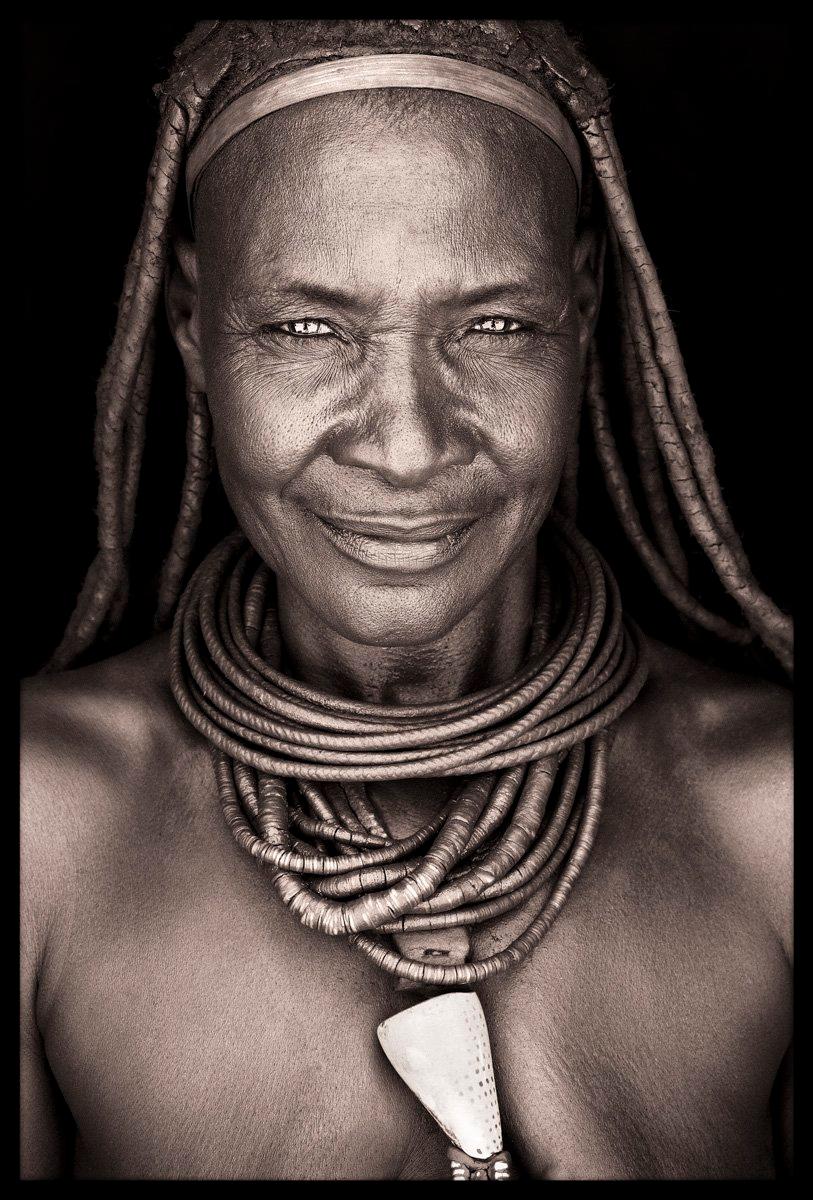 Himba women have a devotion to red ochre powder and butter fat that exceeds even the Hamer of the Omo valley in Ethiopia.  They apply huge amounts to almost their entire bodies including the hair, skin and the jewellery.

This older Himba lady was