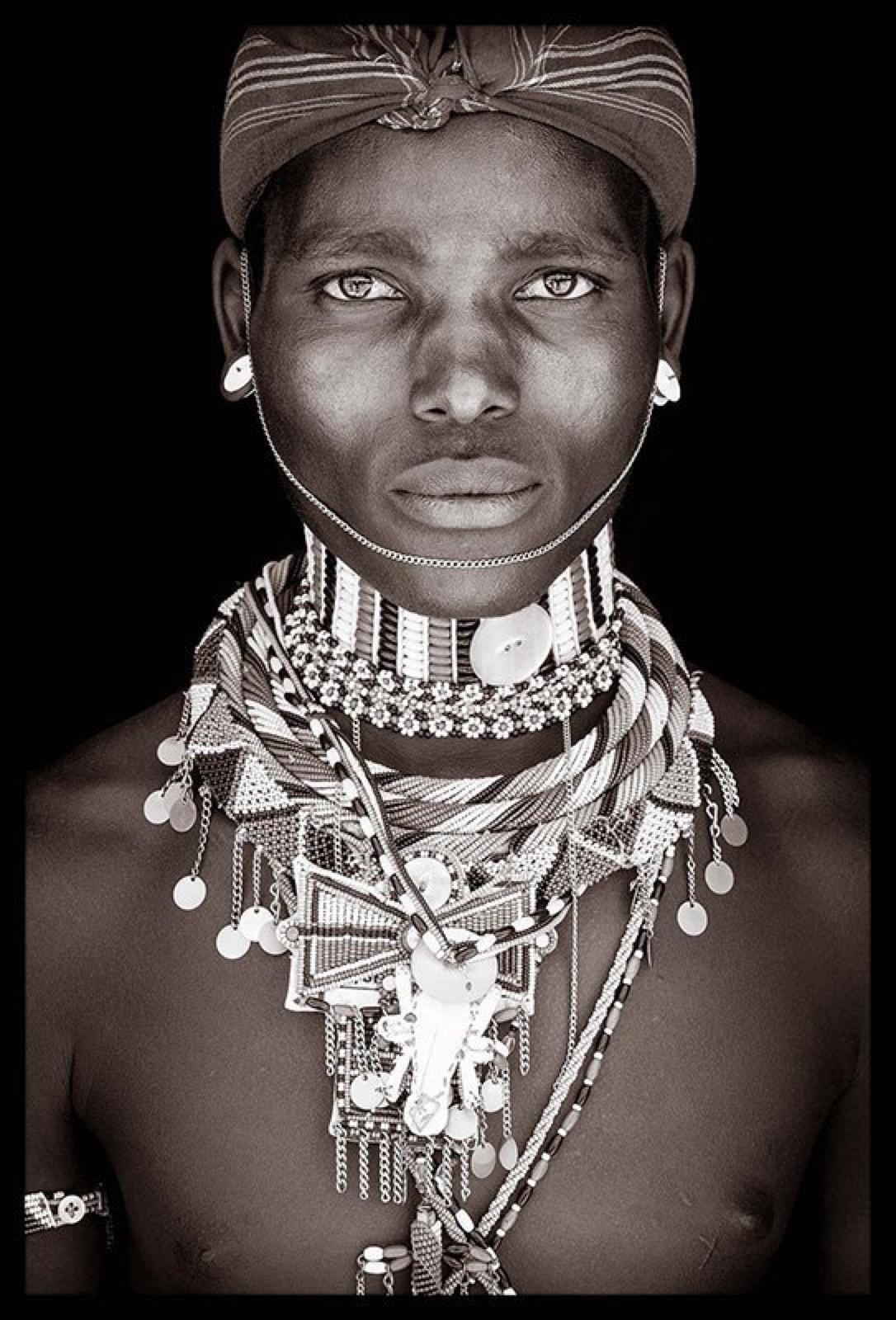 Rendille warrior from Northern Kenya

John Kenny’s work is all shot on location in some of the remotest corners of Africa. His subjects are lit with natural light and wear their day to day attire.

The C-type prints are mounted with an acrylic face