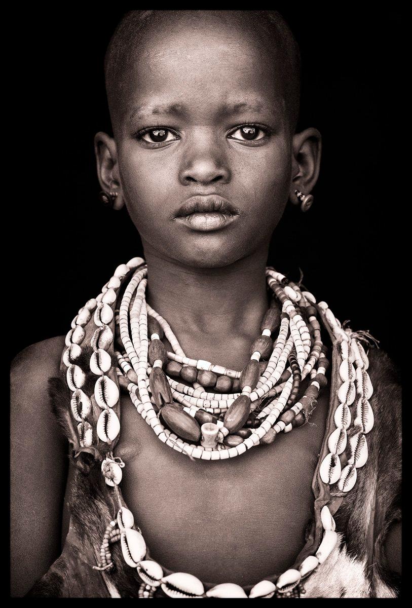 A young Hamer boy near the village of Turmi, Ethiopia. The young of Hamer society are at an important point in their societies’ history as their way of life is changing from a focus on traditional animals, crops and the trade of rural products –
