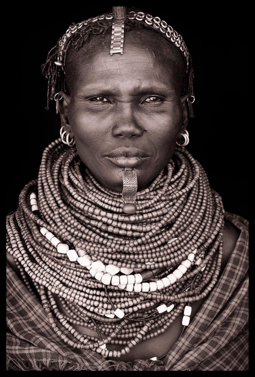 The jewellery of the Arbore is among the most colourful in the whole of the Omo Valley: they are experts in recycling materials for beauty, particularly metal watch-straps.

John Kenny’s work is all shot on location in some of the remotest corners