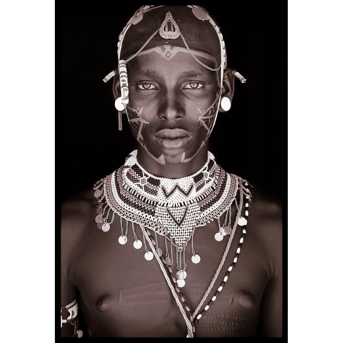 A portrait of Lekutano, a Samburu man from northern Kenya in 2019.

John Kenny’s work is all shot on location in some of the remotest corners of Africa. His images are all taken with natural light and his subjects in their day to day attire.

The