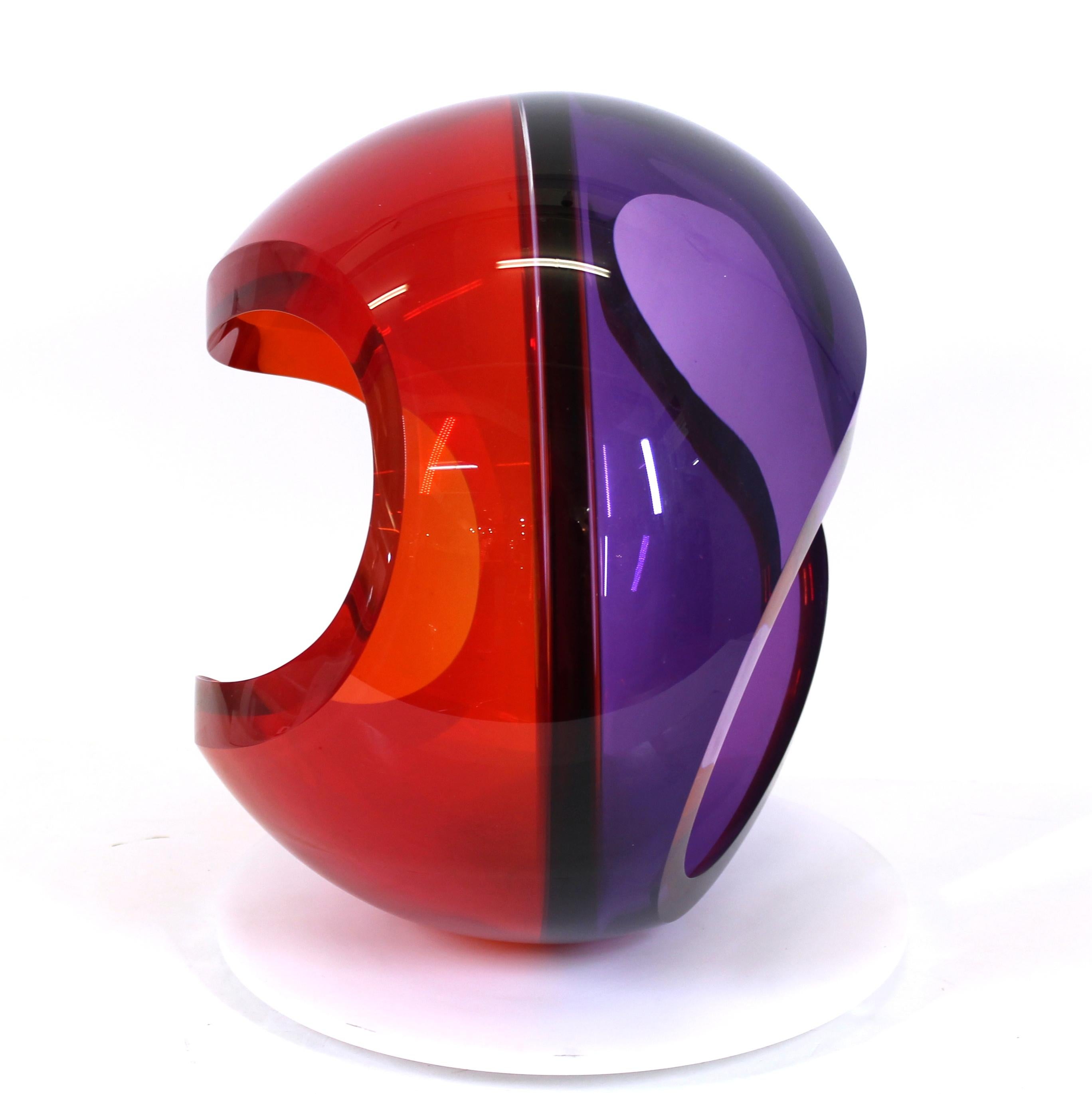John Kiley (b. 1973) American studio art glass sculpture of a bi-colored glass orb with open sides, mounted on a rotating platform, measures: 16