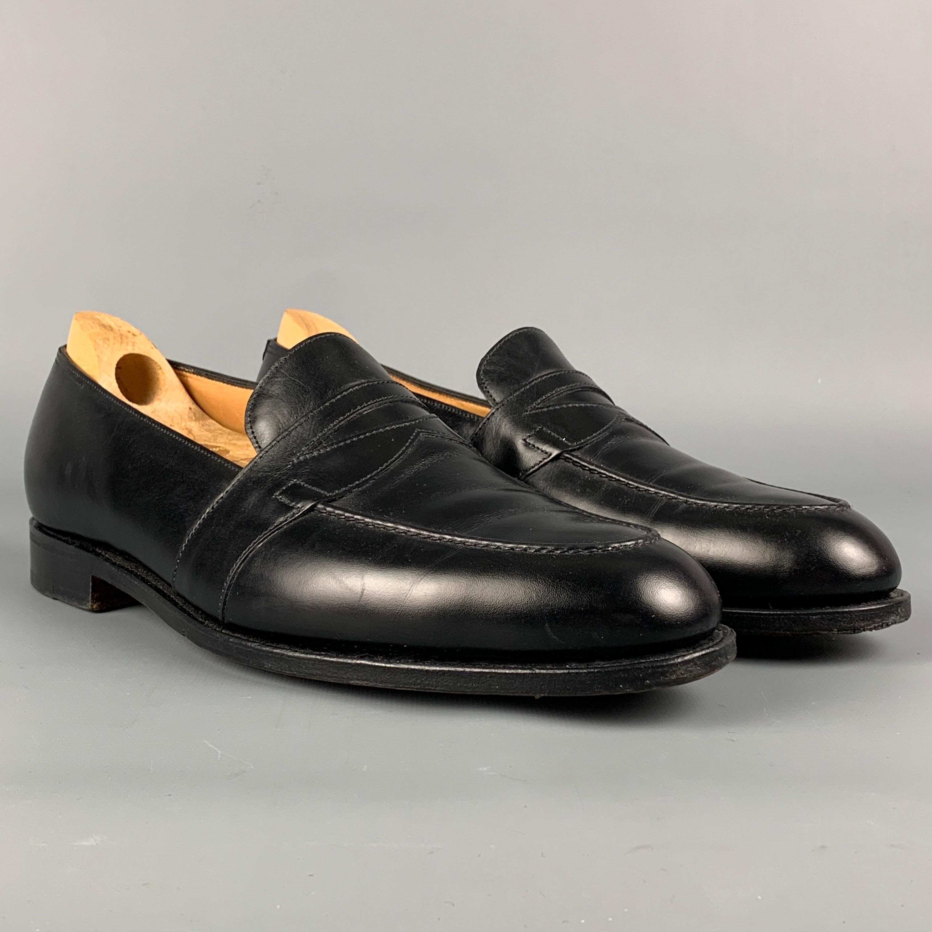 JOHN LOBB loafers comes in a black leather featuring a penny strap and a slip on style. Includes shoe horn. Made in England. 

Very Good Pre-Owned Condition.
Marked: 8.5
Original Retail Price: $1,495.00

Outsole: 12 in. x 4 in. 