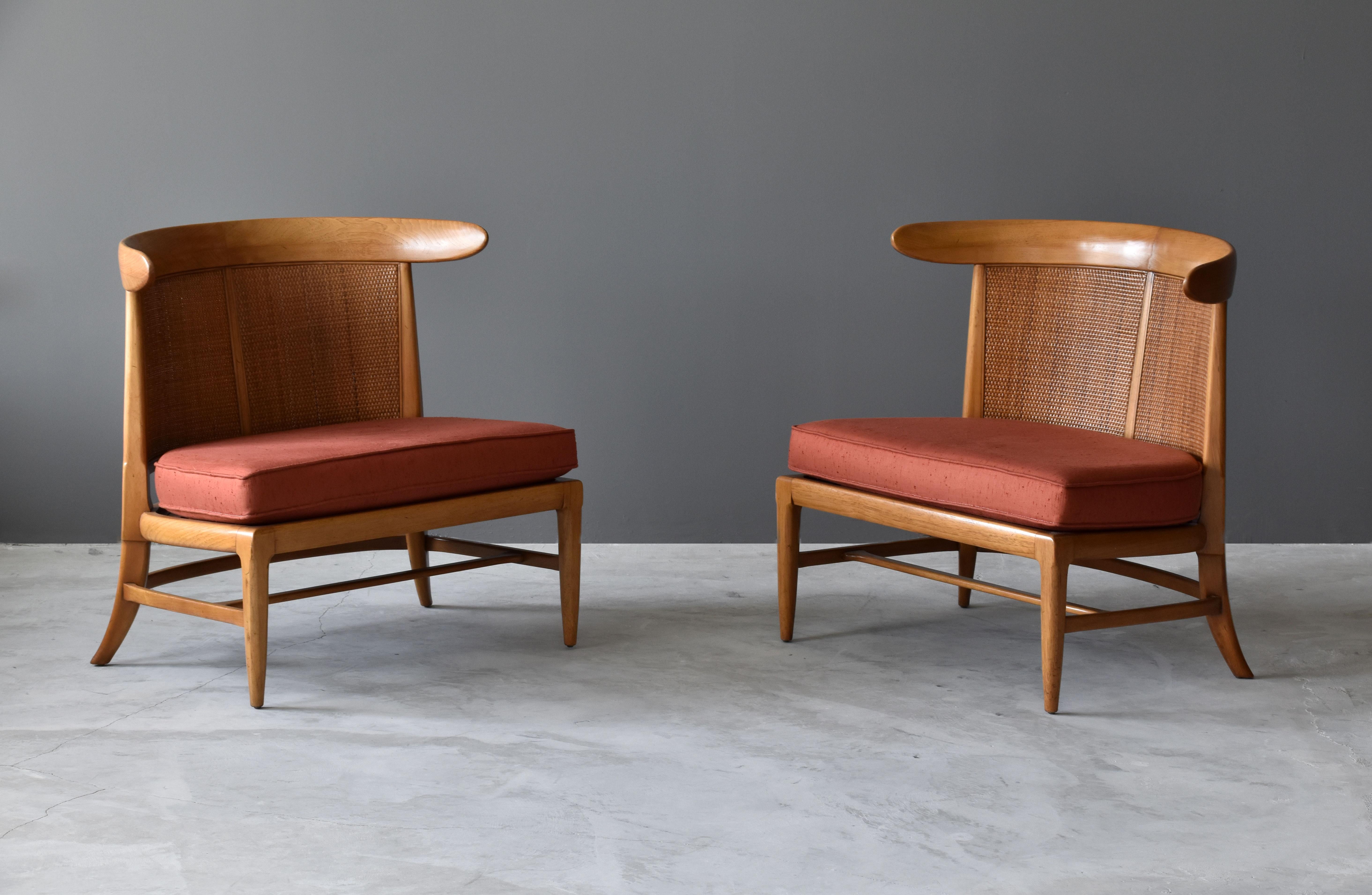 A pair of walnut lounge chairs with original cane/rattan braided backs and fabric cushions. Designed by John Lubberts & Lambert Mulder for Tomlinson collection, America, circa 1950.

Other American designers of the era include Edward Wormley, T.H.