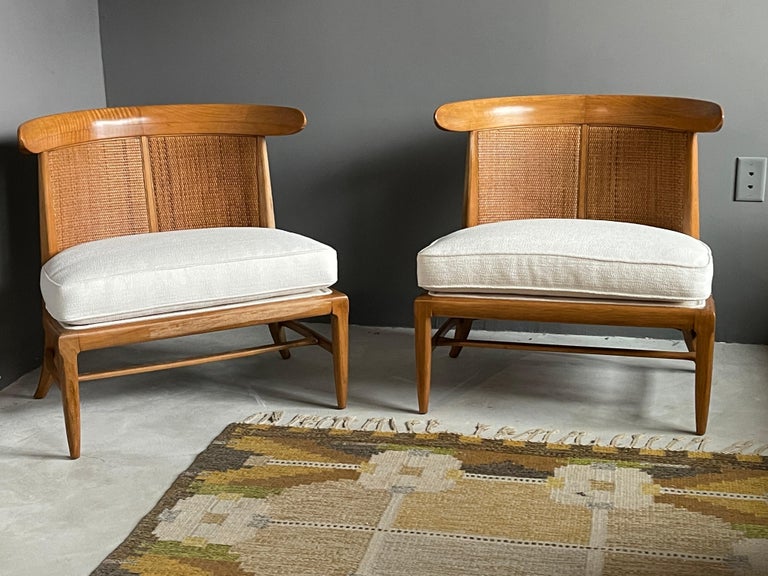 A pair of walnut lounge chairs with original cane or rattan braided backs and fabric cushions. Designed by John Lubberts & Lambert Mulder for Tomlinson collection, America, circa 1950.

Other American designers of the era include Edward Wormley,