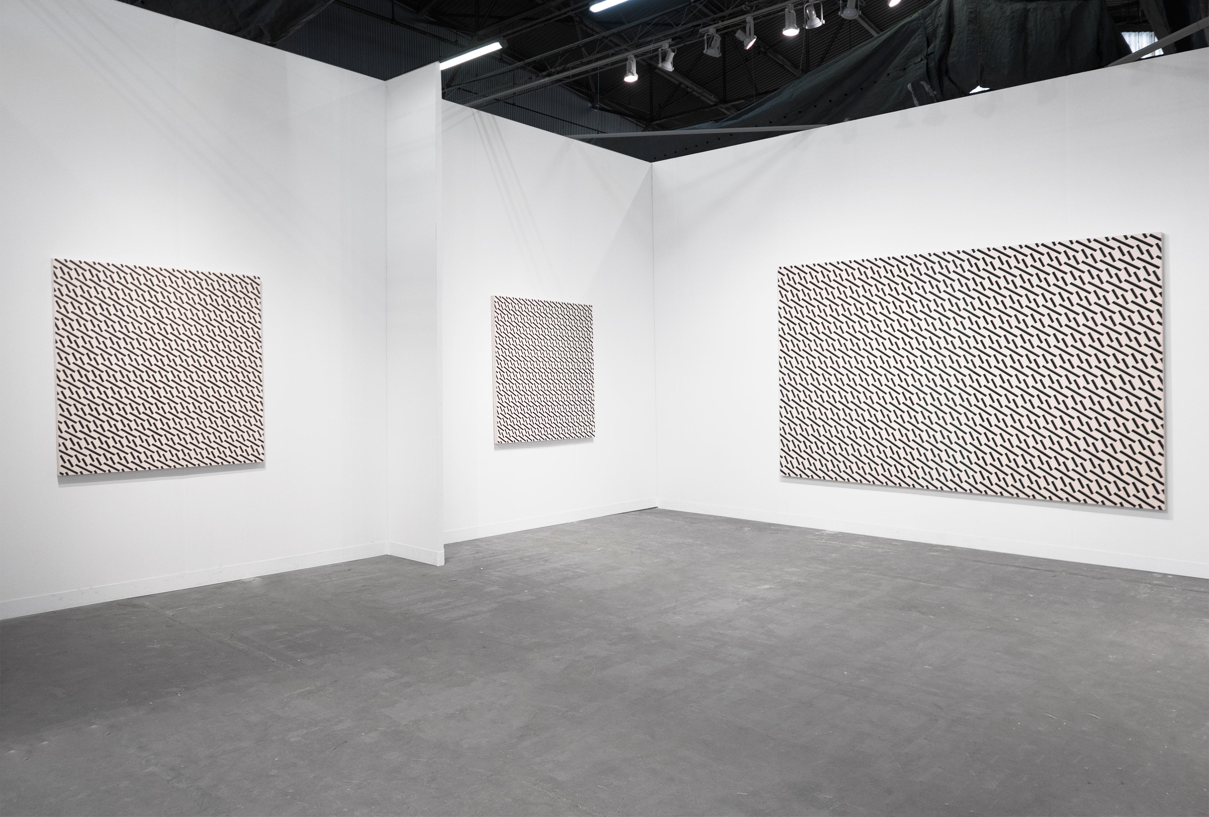 In the early 1970s, celebrated artist John M. Miller abandoned figurative painting and stripped art down to its essence, which, for him, took the form of angled, colored bars repeated across the picture plane. He has been painting these bars—in