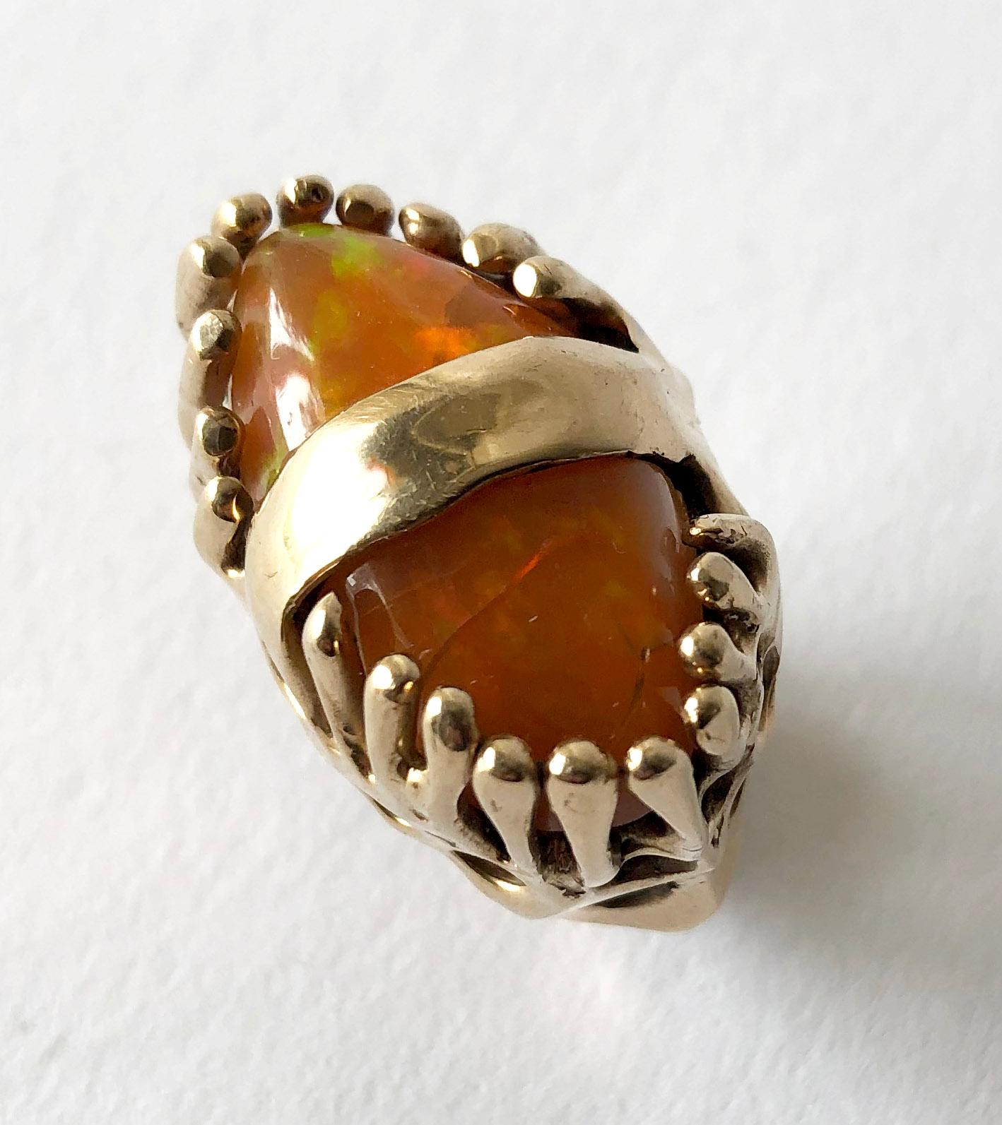 Modernist 14k gold with orange fire opal ring by John M. Morgan of Ellensburg, Washington. Brutalist, organic setting with two prong set orange fire opal pebbles.  Ring is a finger size 5.5 - 6 and weighs 25.3 grams. In very good vintage
