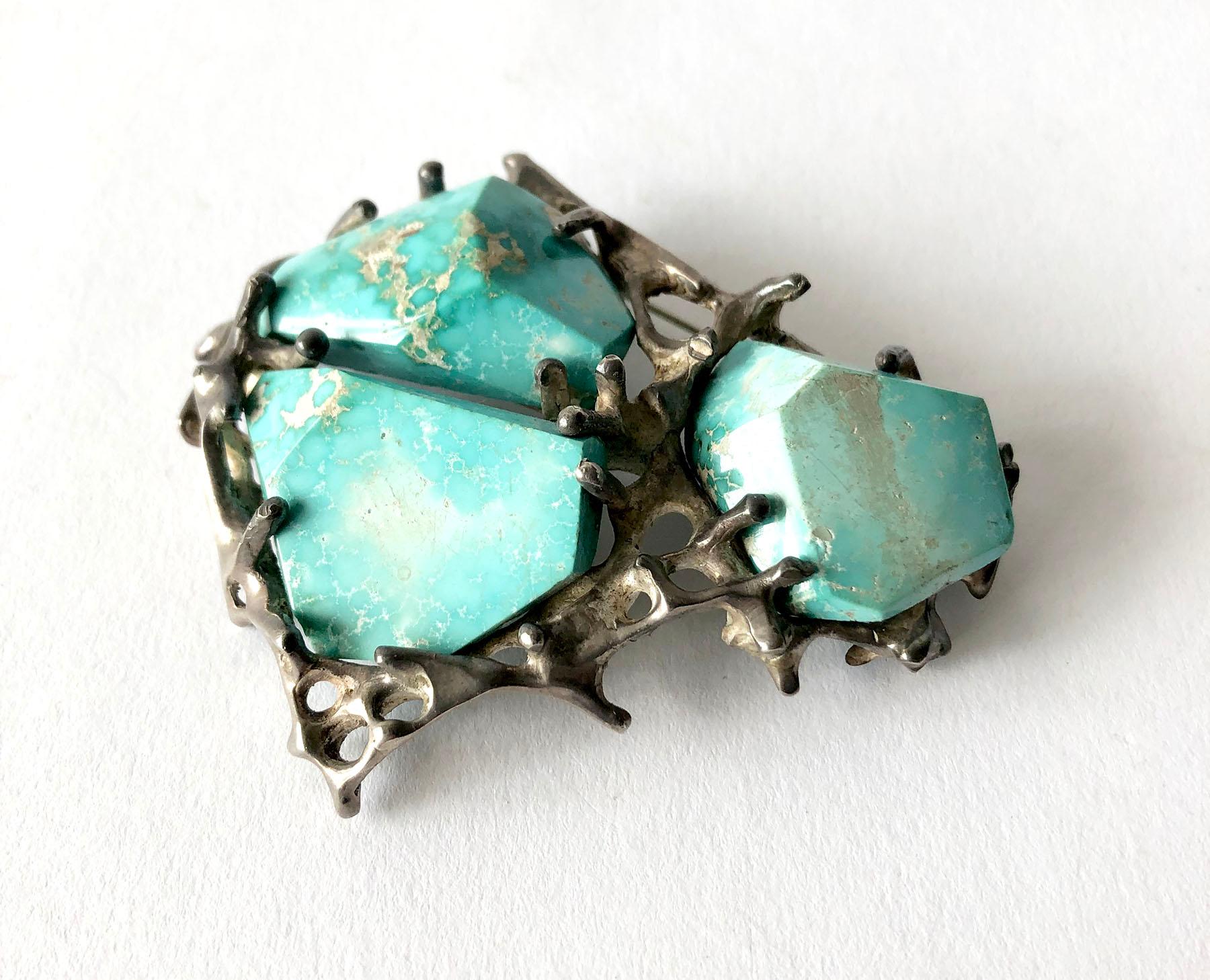 Large scale, faceted turquoise and sterling silver brooch made by John M. Morgan of Ellensburg, Washington.  Brooch measures 2.5