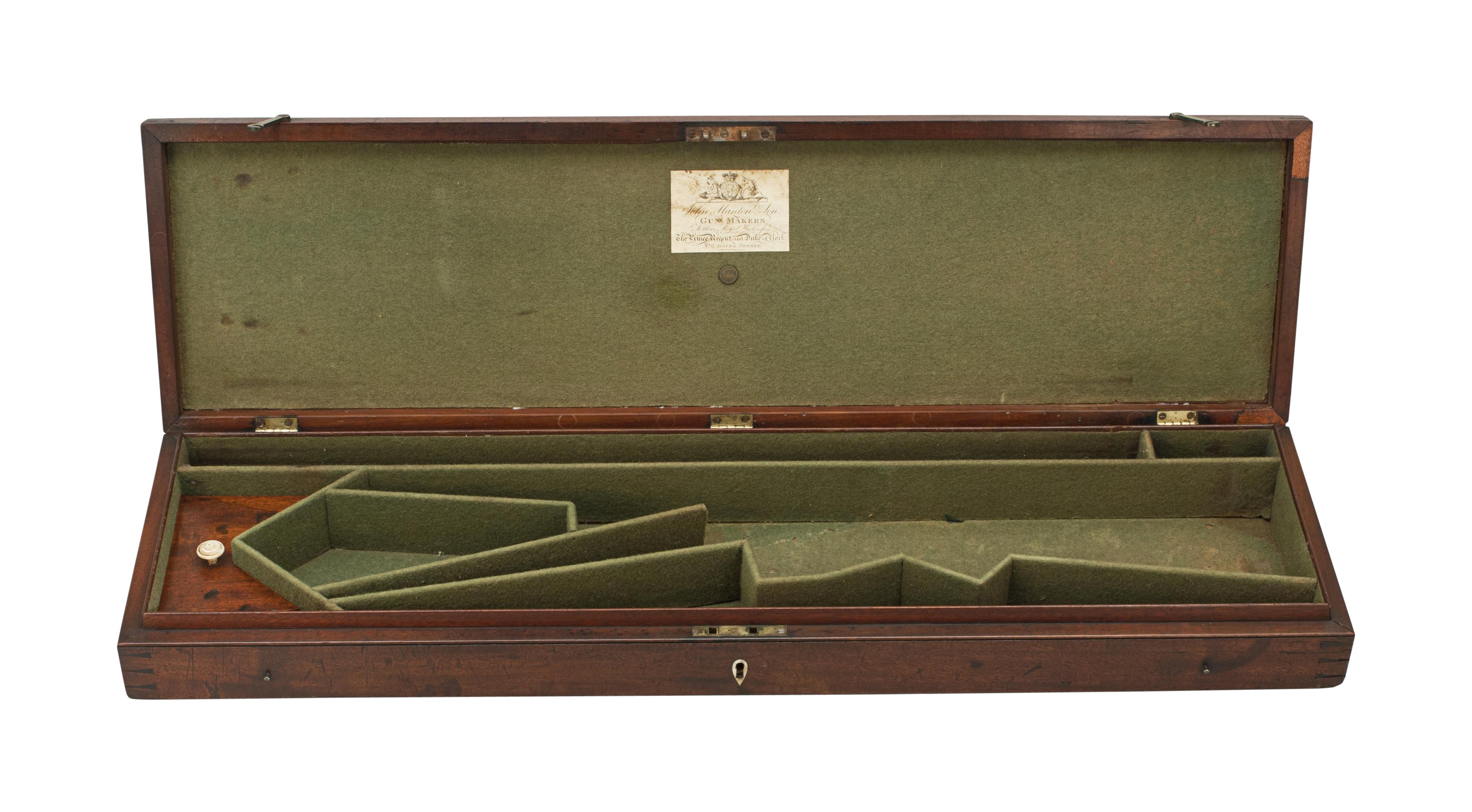 John Manton mahogany sporting gun case.
A mahogany gun case by John Manton & Son, No.6 Dover Street, London, the green baize lined case with dividers and fitted for a double barrel shotgun. The inside of the lid with paper trade label for John