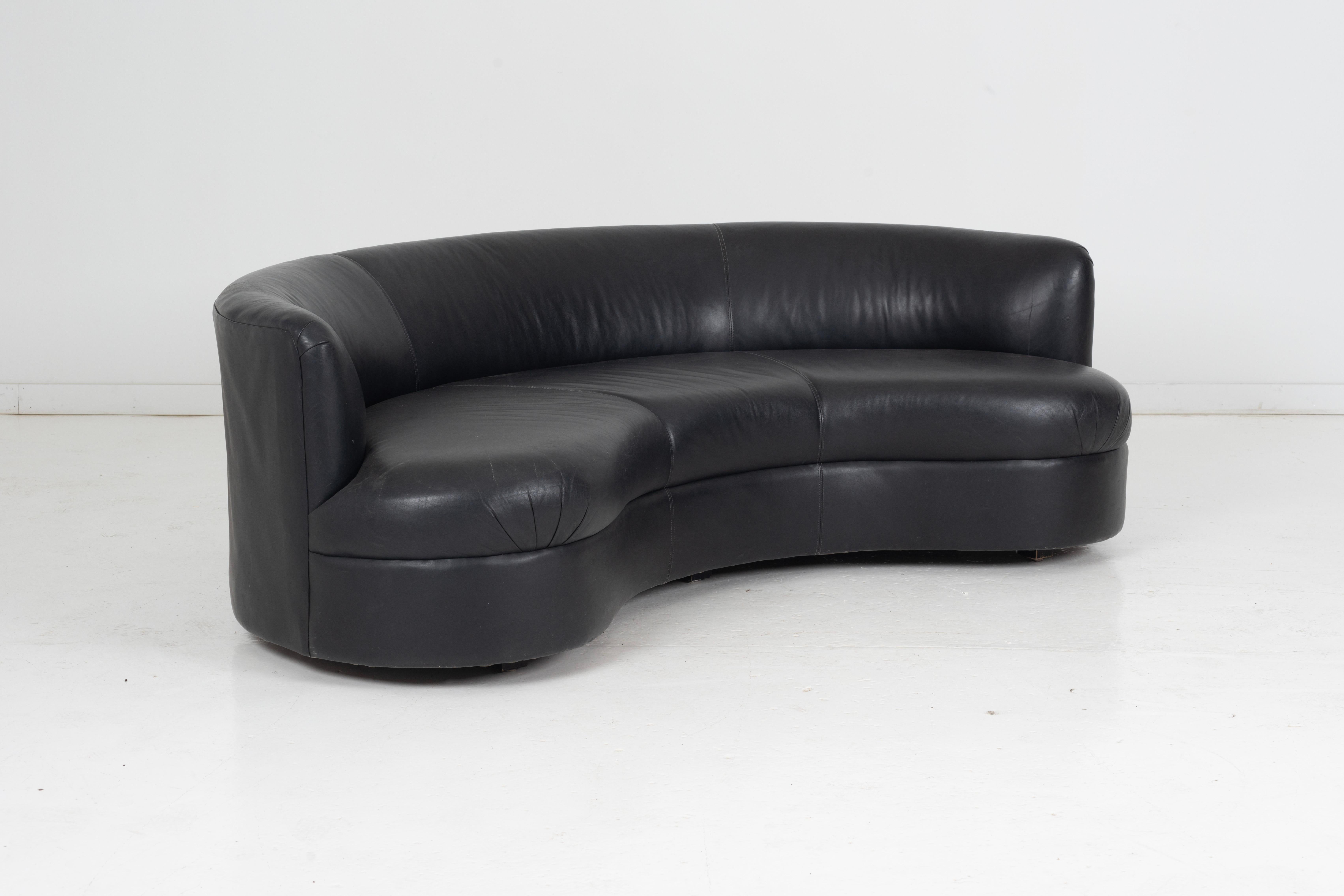 black leather curved sofa