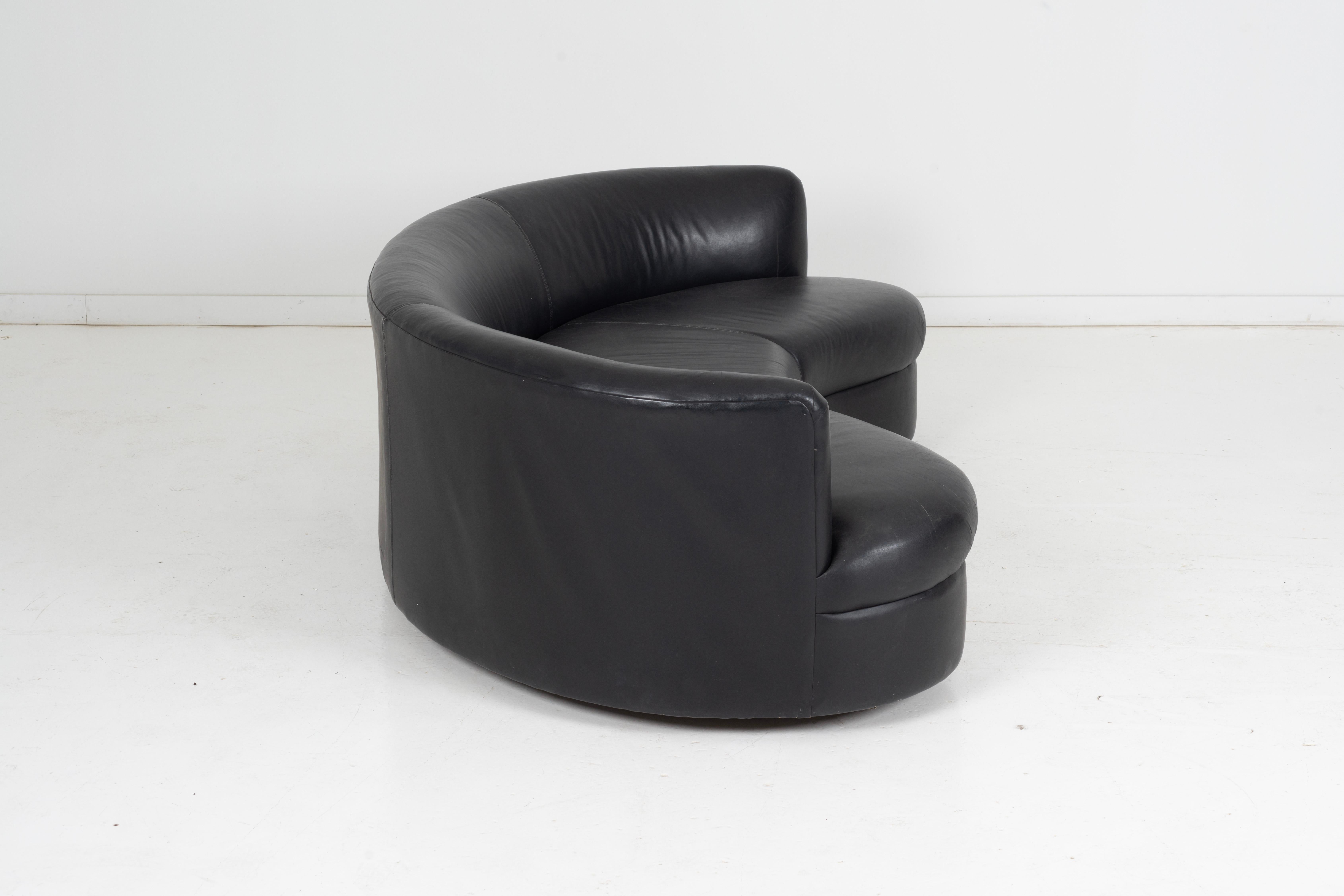 curved black leather sofa