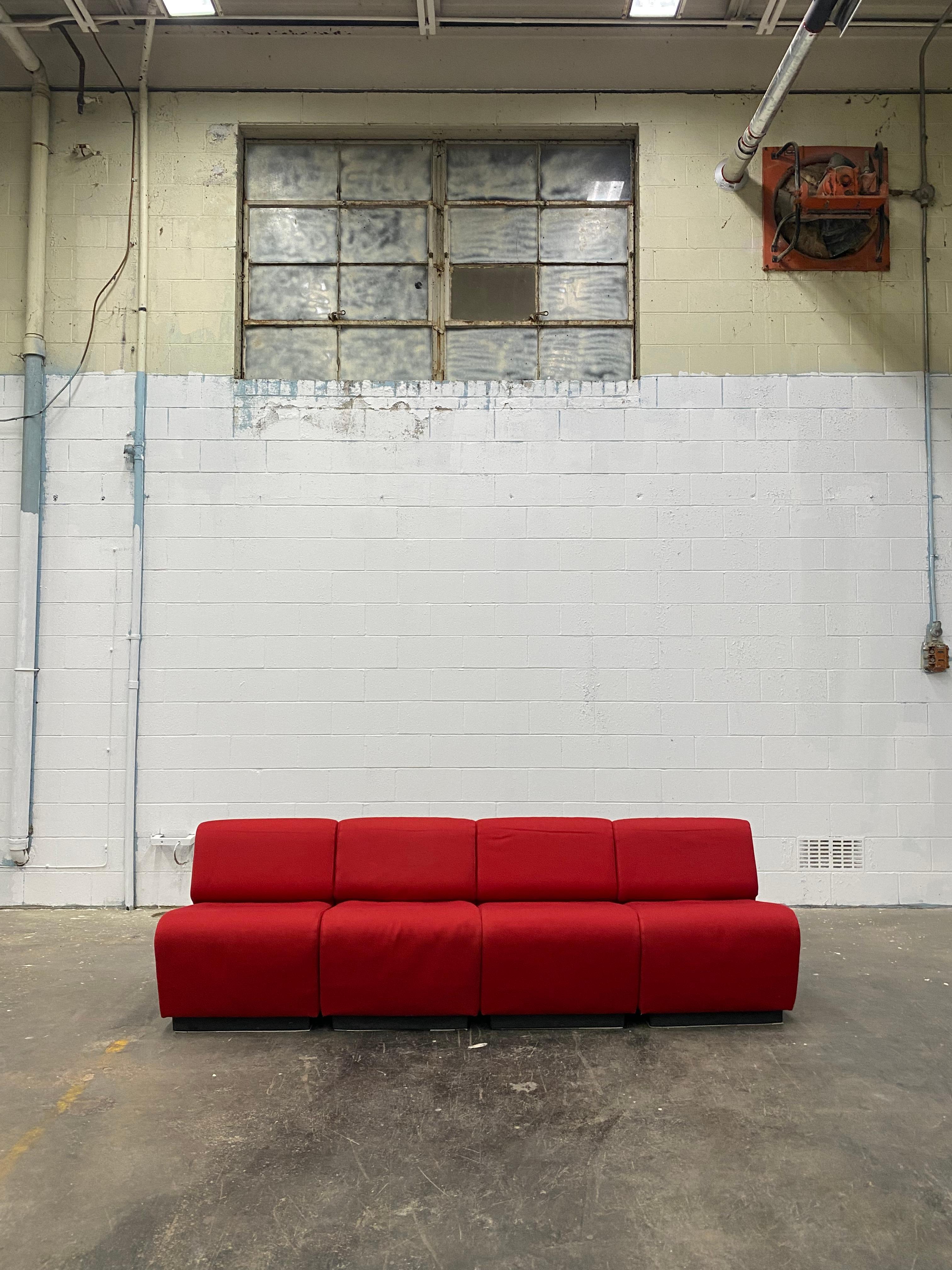 John Mascheroni for Vecta Tappo Modular Sectional sofa.

This sofa was procured from the Steelcase headquarters in Grand Rapids, MI.
The deep bright red upholstery highlights the modern and contemporary feel of the sofa. The whole sofa is