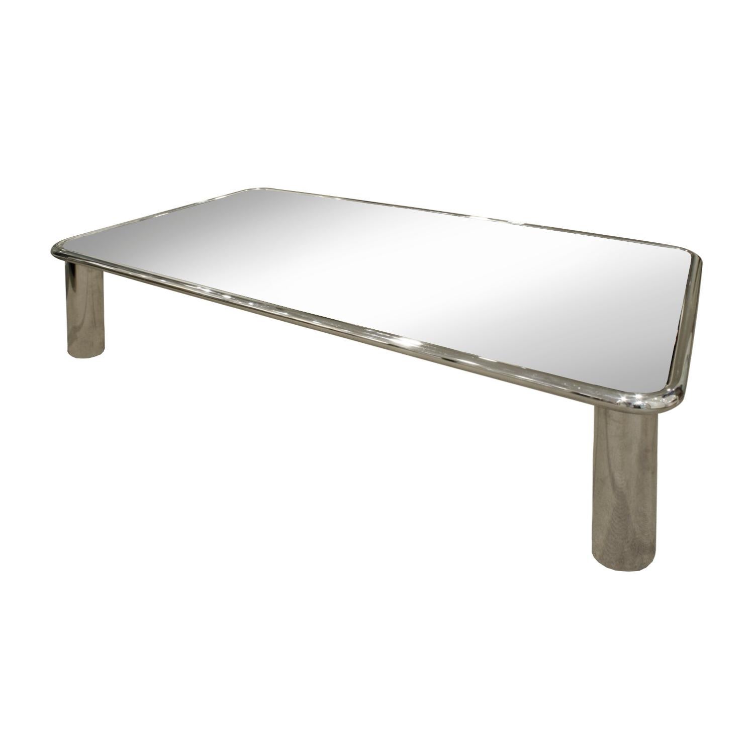 Large coffee table with legs in polished chrome with inset mirror glass top by John Mascheroni, American 1970s. This coffee table is very chic.