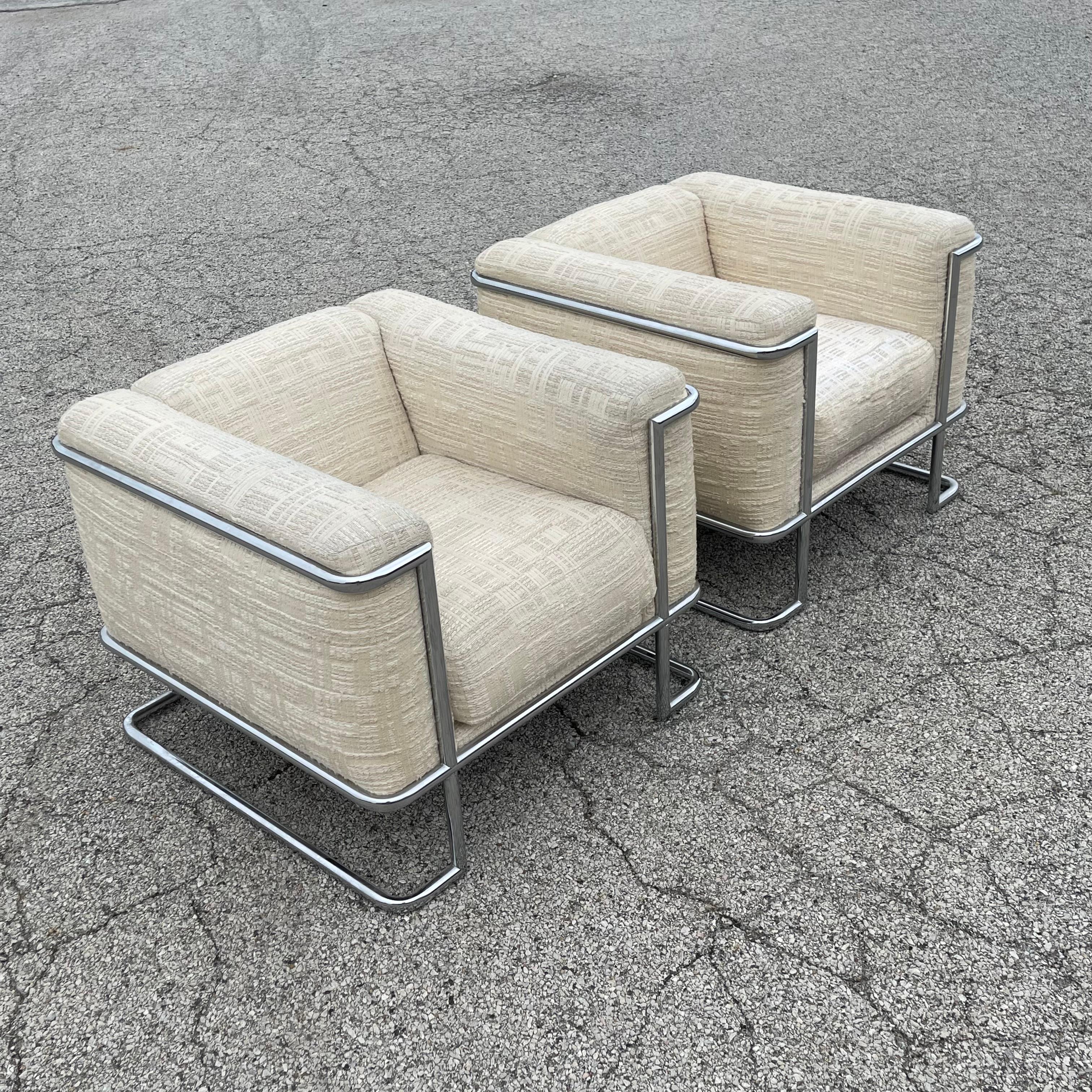 This strikingly handsome and quite rare cube lounge chairs designed by John Mascheroni for Swaim Originals have external frames of tubular chromed steel. The unique design references Le Corbusier's 1929 