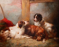 Three Hunting Dogs resting in a stable interior