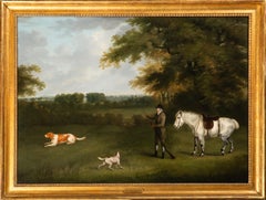 Un chasseur avec chiens et poney