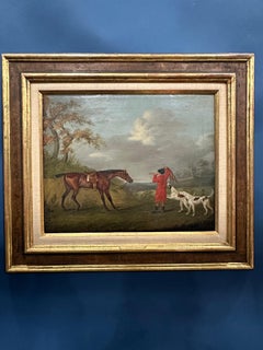 English 19th century Fox hunter with hounds, hunter and rider in a landscape