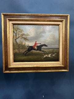 English 19th century Fox hunter with hounds, hunter and rider in a landscape