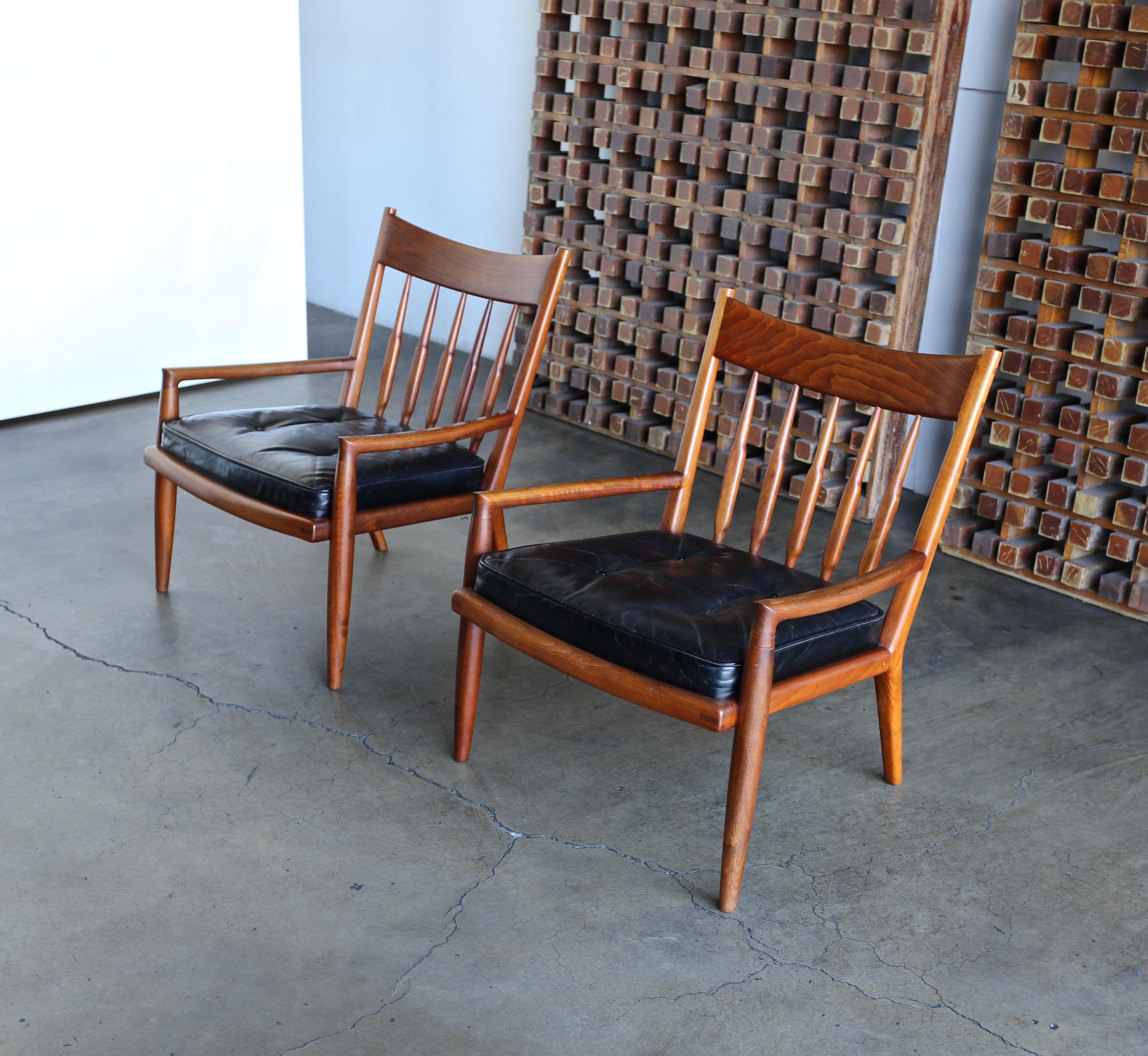Handcrafted walnut lounge chairs by California Craftsman John Nyquist woodworker, circa 1970.