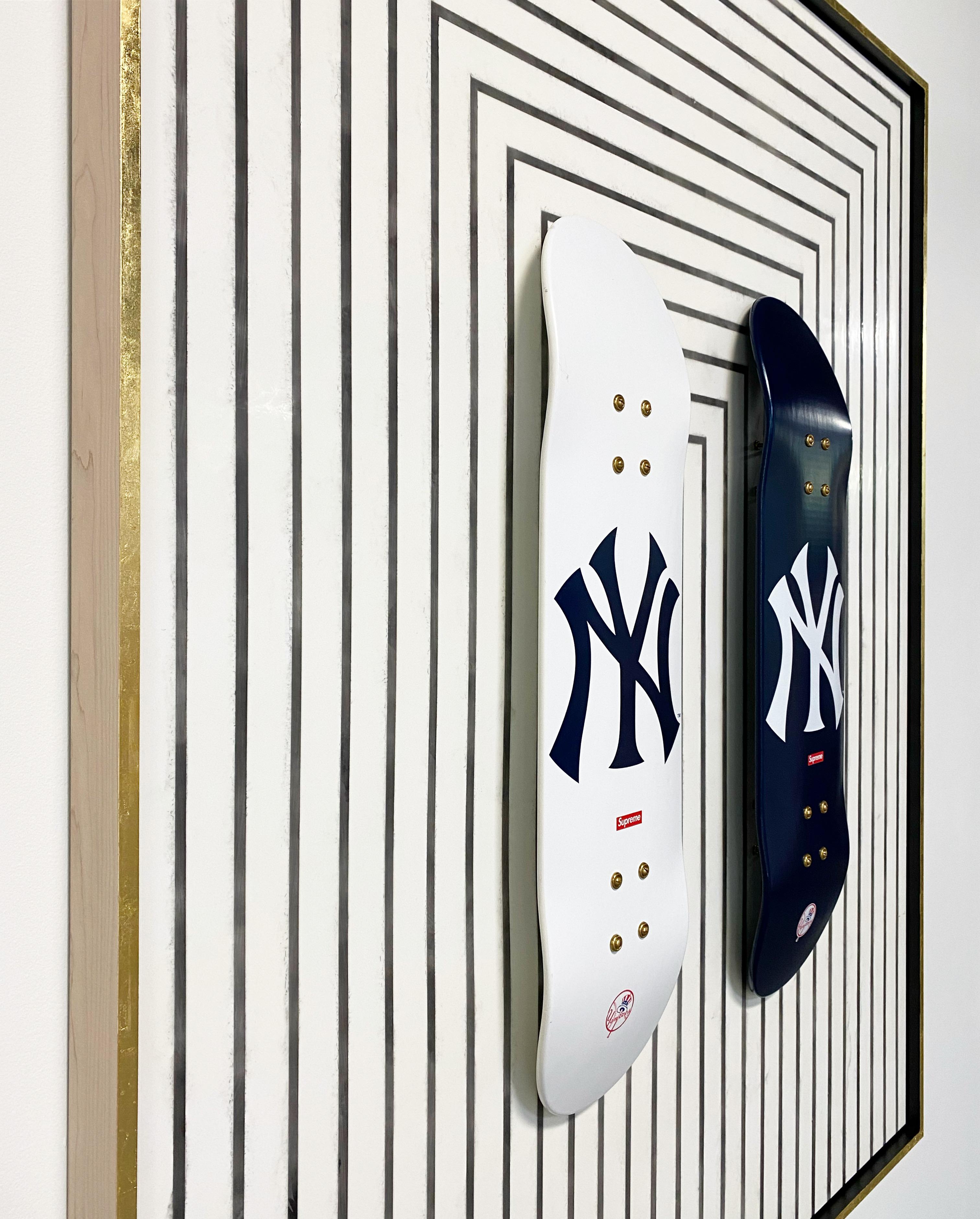 The Deck series. Screen-printed maple skate decks. Float-mounted on encaustic painted board.This skate deck duo was designed by streetwear label, Supreme, in collaboration with the New York Yankees.

Art Dimensions: 48 x 60 H inches
Framed