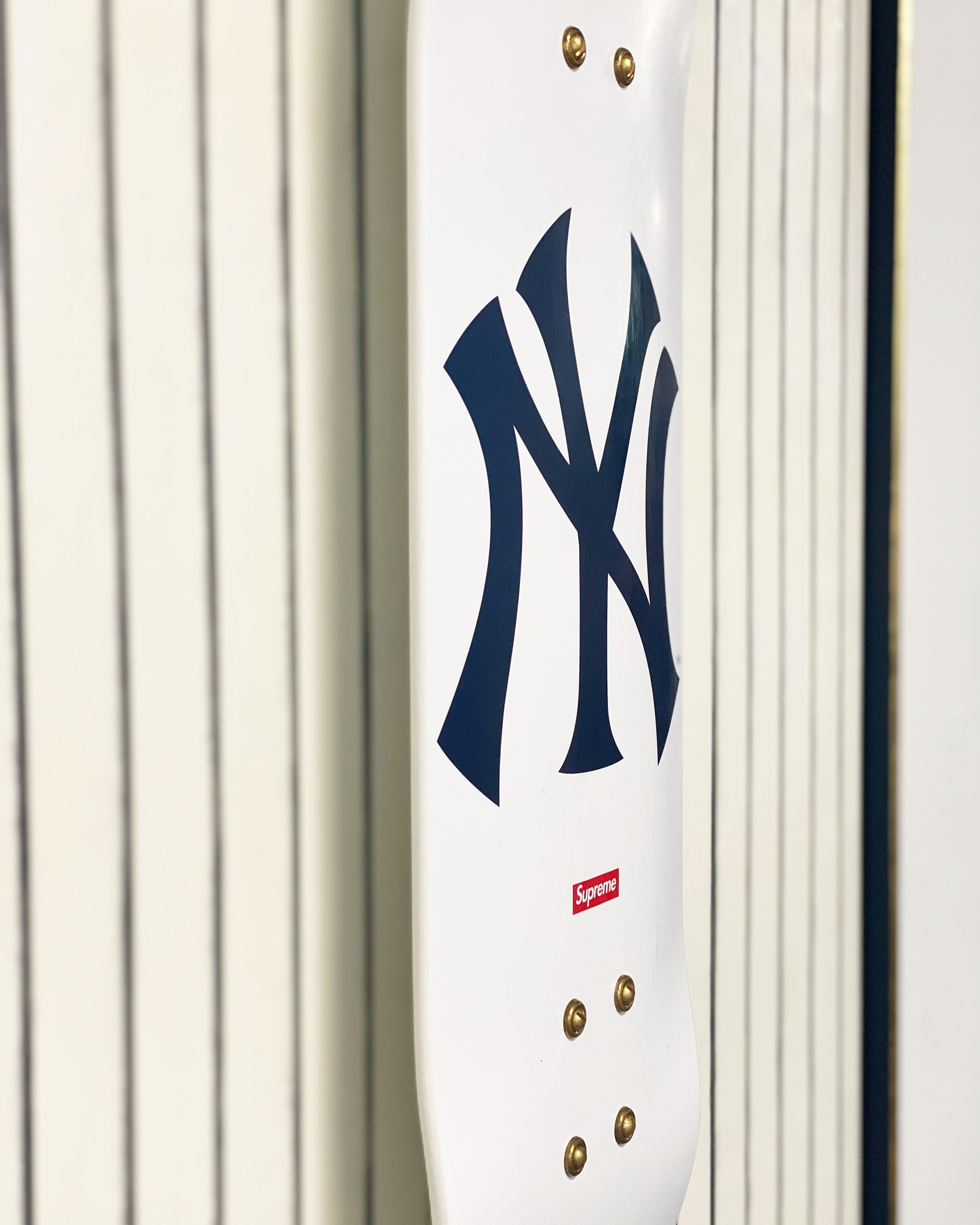The Deck series. Screen-printed maple skate deck. Float-mounted on encaustic painted board.This skate deck was designed by streetwear label, Supreme, in collaboration with the New York Yankees.

Art Dimensions: 36 x 48 H inches
Framed Dimensions: