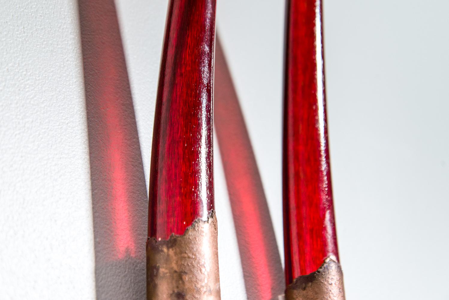 Metaphors of time, space, earth, and its elements are reflected in the elegant and glowing glass sculptures by Canadian artist John Paul Robinson. This large, stunning glass and metal piece in deep red mimics the mesmerizing flames of a fire. In