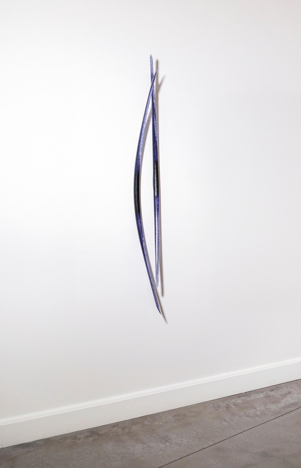 This contemporary blue glass wall sculpture is made by a Canadian artist.

John Paul Robinson’s award winning glass work is inspired by the artist’s fascination with the complex world of scientific discovery, nature and our own mythological beliefs.