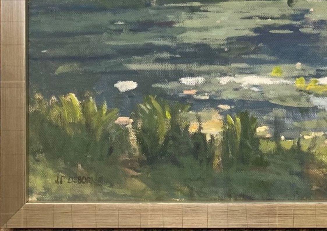 The water glistens on a sunwashed paradise.  Legendary artist John Phillip Osborne has used prismatic light and tonal progression coupled with impressionist brush strokes to achieve this enchanting, 28x40 original oil painting of a pond with lilies.