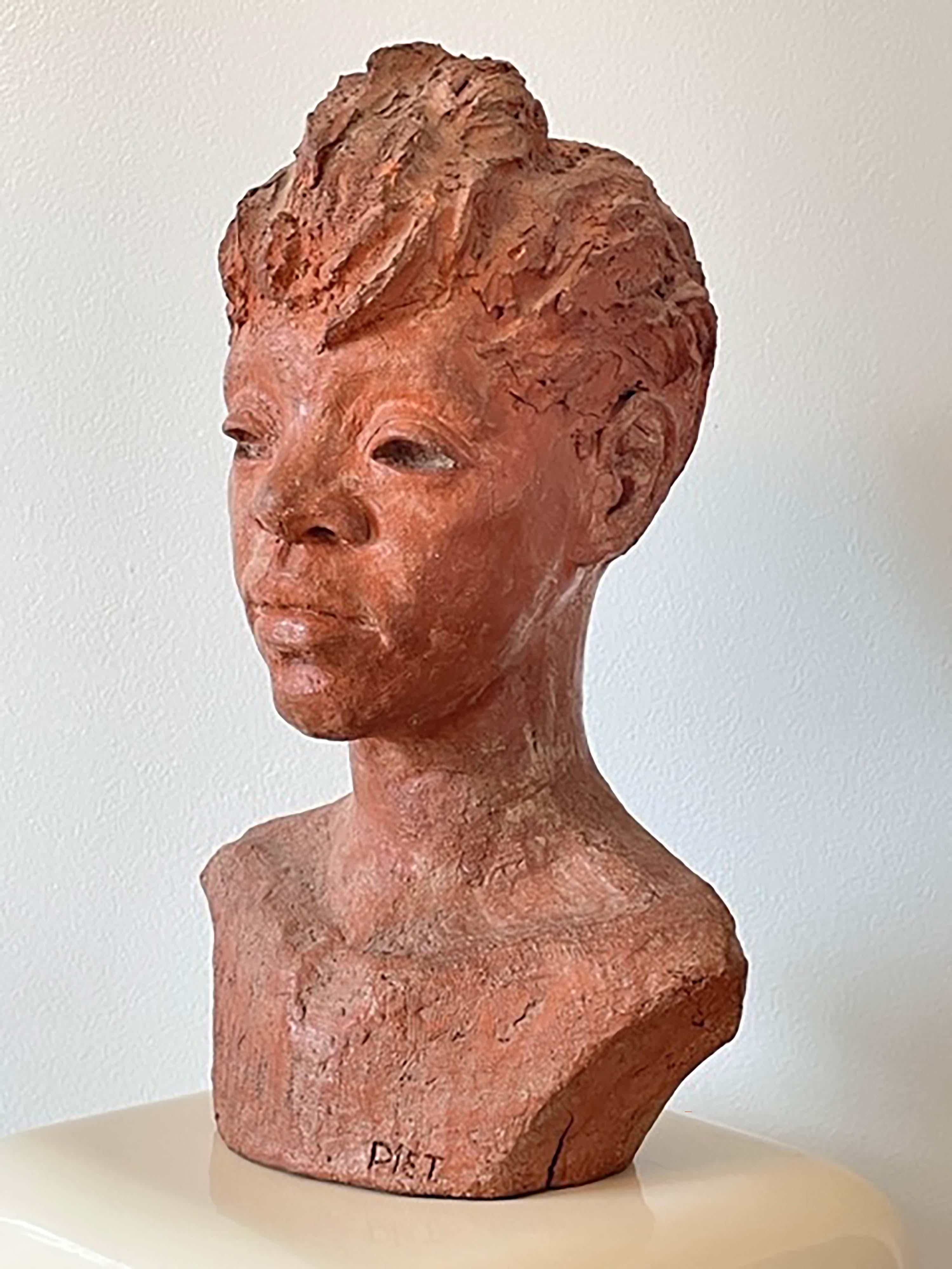 A contemplative modern terracotta ceramic bust sculpture by Michigan artist John Piet. Signed on bottom. Circa mid to late 20th century. A life size sculpture with a certain introspective quality. John Piet was a successful sculptor, ceramicist,
