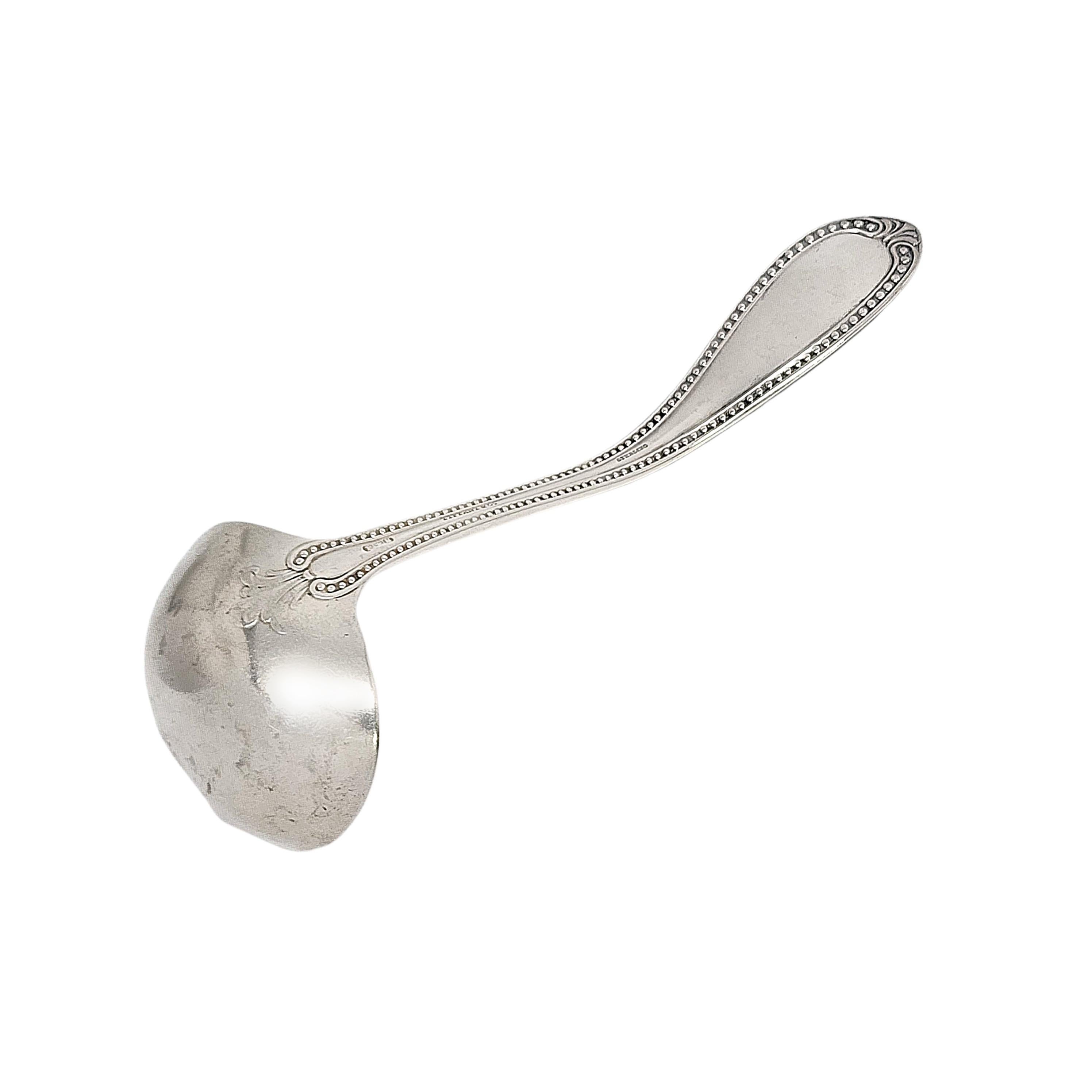 Sterling silver bead ladle with monogram by John Polhamus for Tiffany & Co.

Monogram appears to be MP

This small ladle features a beaded edge handle design. Does not include Tiffany & Co box or pouch.

Measures approx 6 3/4