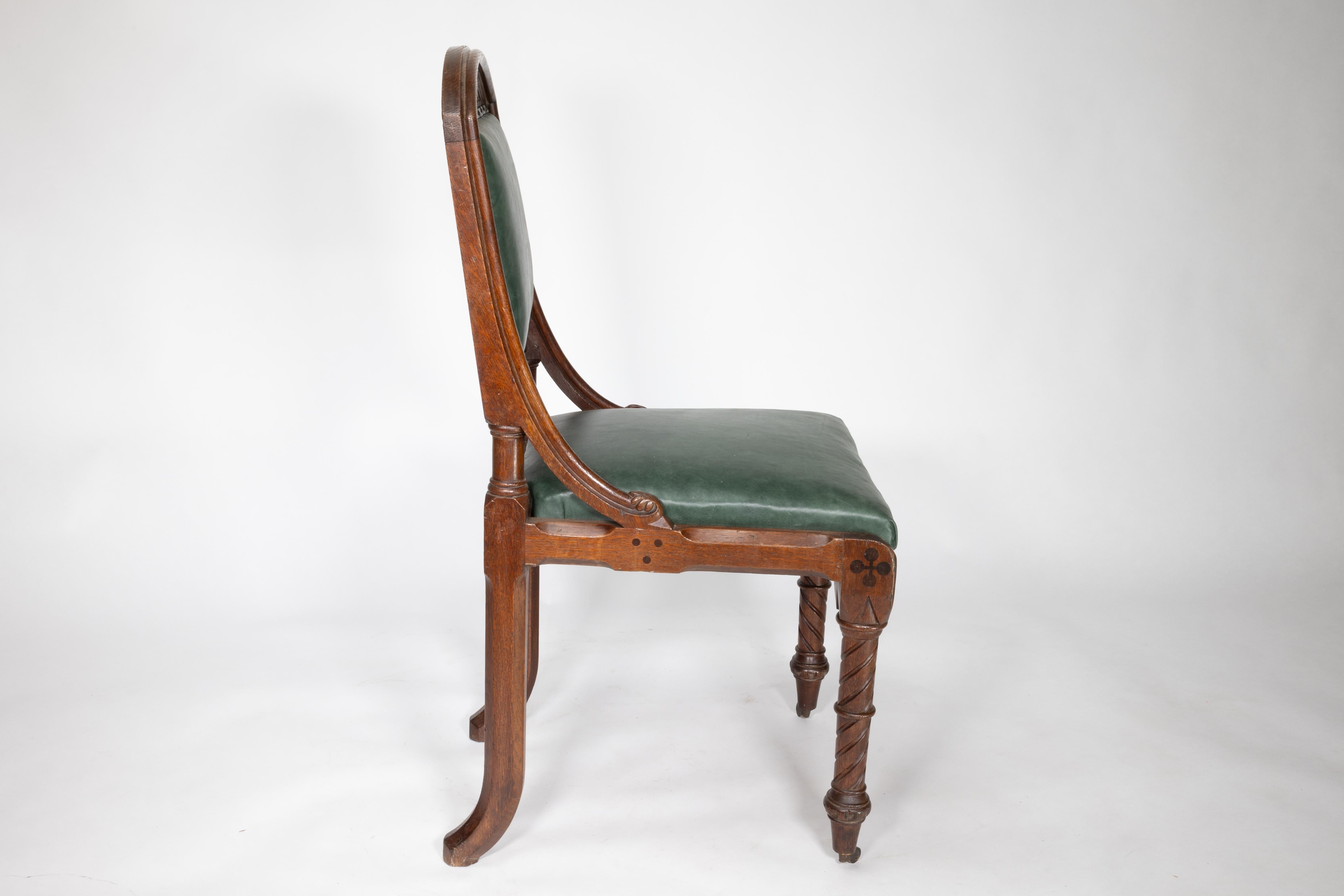 John Pollard Seddon (attributed). A good Gothic Revival oak side or desk chair of superior quality with carved ripple scroll details to the head rest and curved side supports joining to the seat sides with carved knops to the end, the front legs