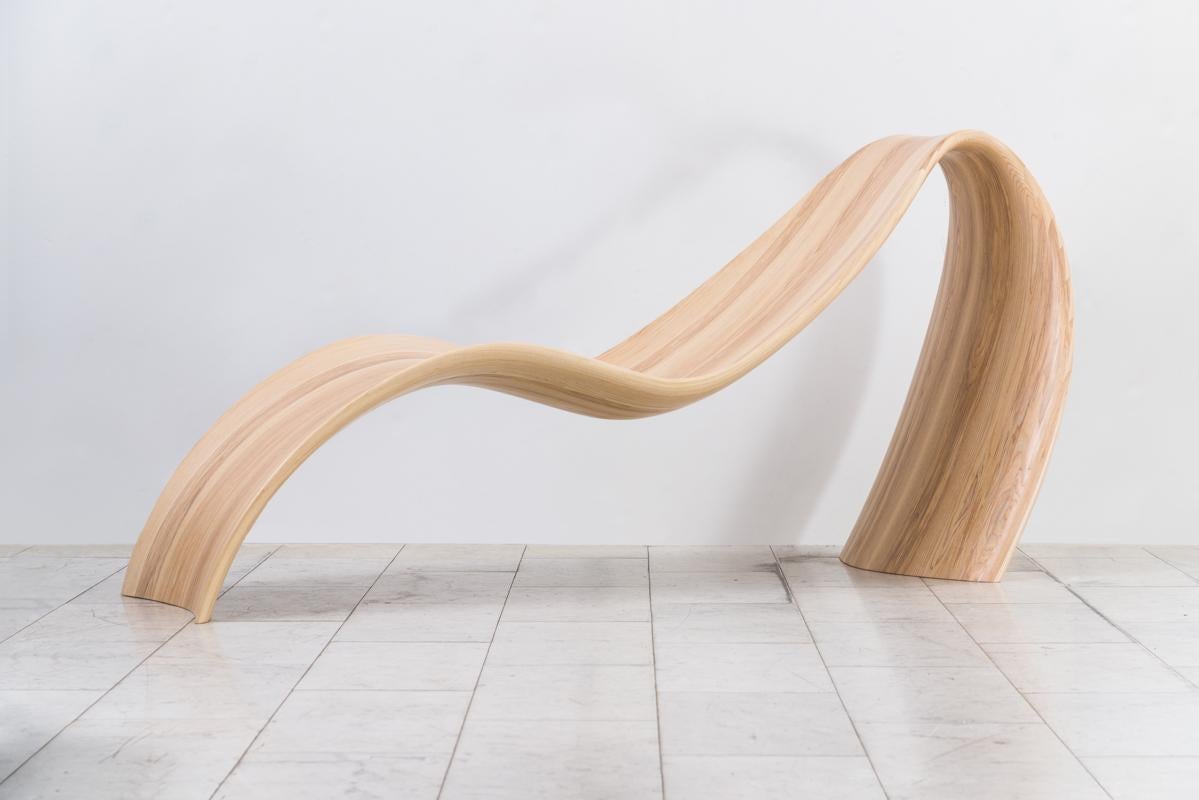 The elegance of John Procario’s Freeform Series is translated in his bentwood Freeform Series Lounge Chair through the artist’s enduring focus on the natural beauty of his chosen material and the deliberate pressure used to exploit its inherent
