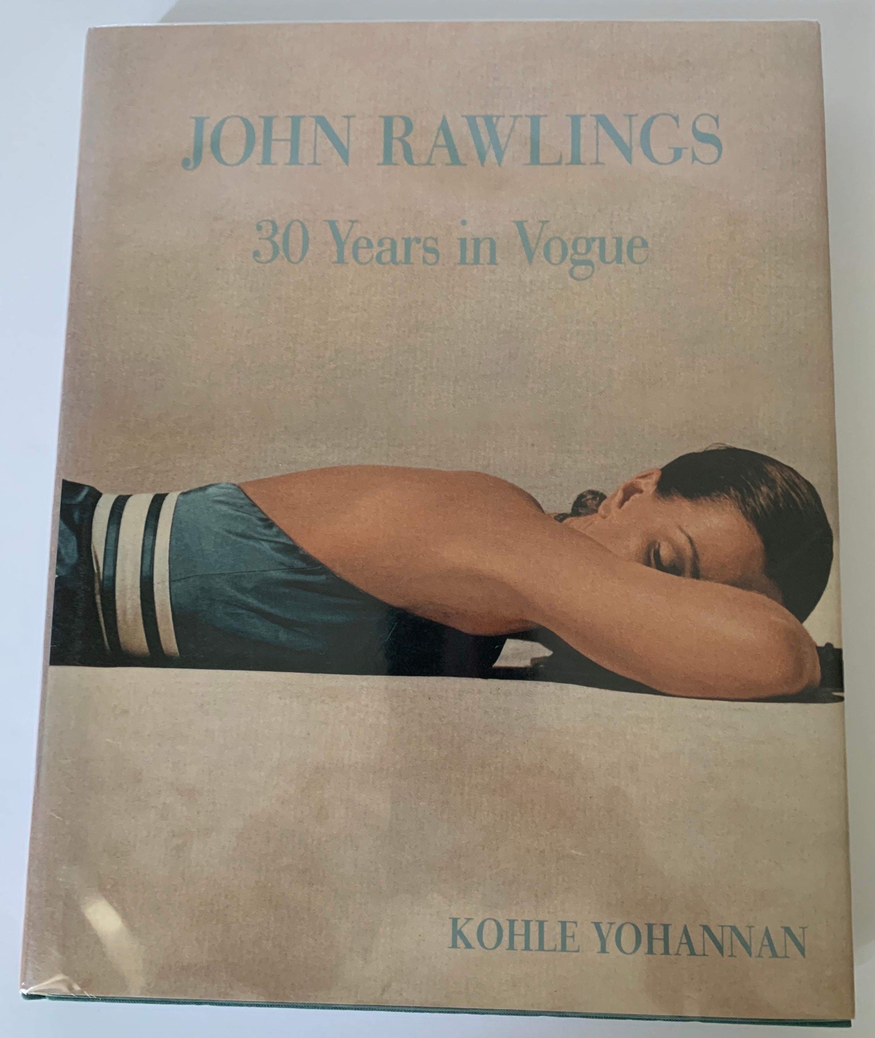 John Rawlings 30 Years in Vogue hardcover first edition. Featuring the photographs of noted fashion photographer John Rawlings and his work with Vogue magazine.
Dust jacket is wrapped in Mylar.