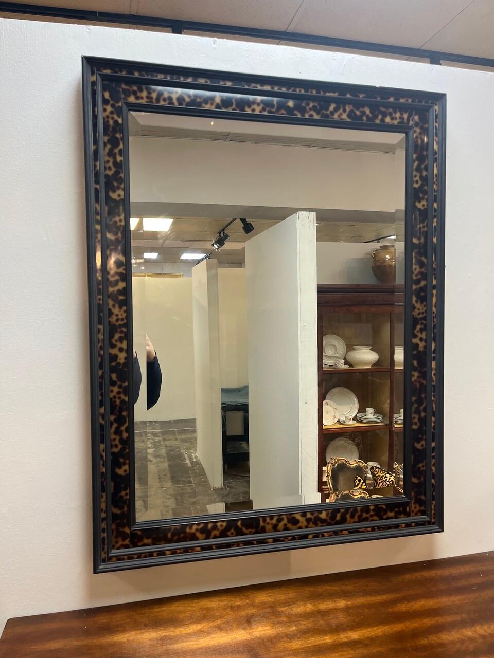 Chic faux tortoise and ebonized wood wall mirror having beveled mirror by John Richard can be hung either way