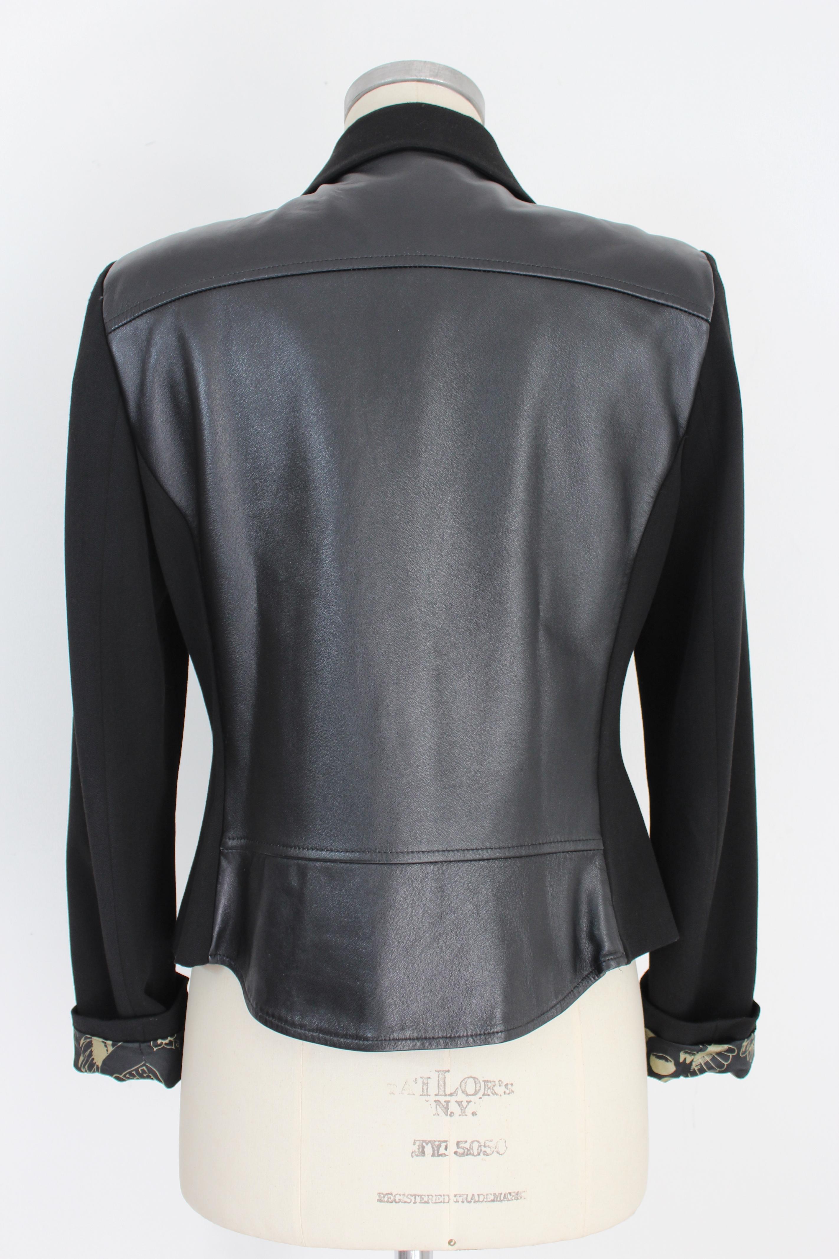 John Richmond 2000s jacket. Elegant jacket, short at the waist, fitted. Black color, internal straps. Fabric 64% polyester, 31% viscose, 5% elastane, the shoulder is 100% leather, internally lined. Made in Italy.

Condition: Excellent

Item used few