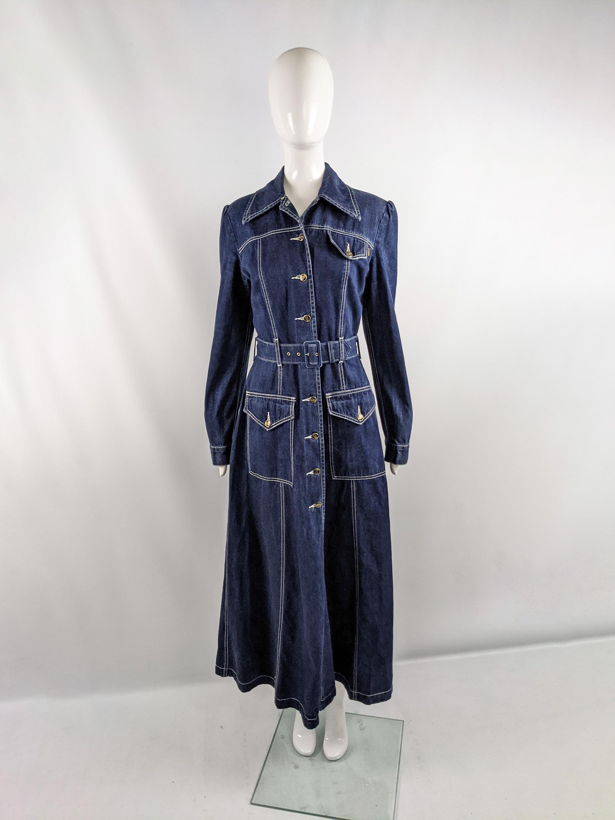 A cool and rare vintage womens maxi coat / dress from the 90s by iconic British designer, John Richmond for his cult label, Destroy. In a blue denim with a matching belt, Richmond's anarchy logo on buttons down the front and a wide, spread collar.