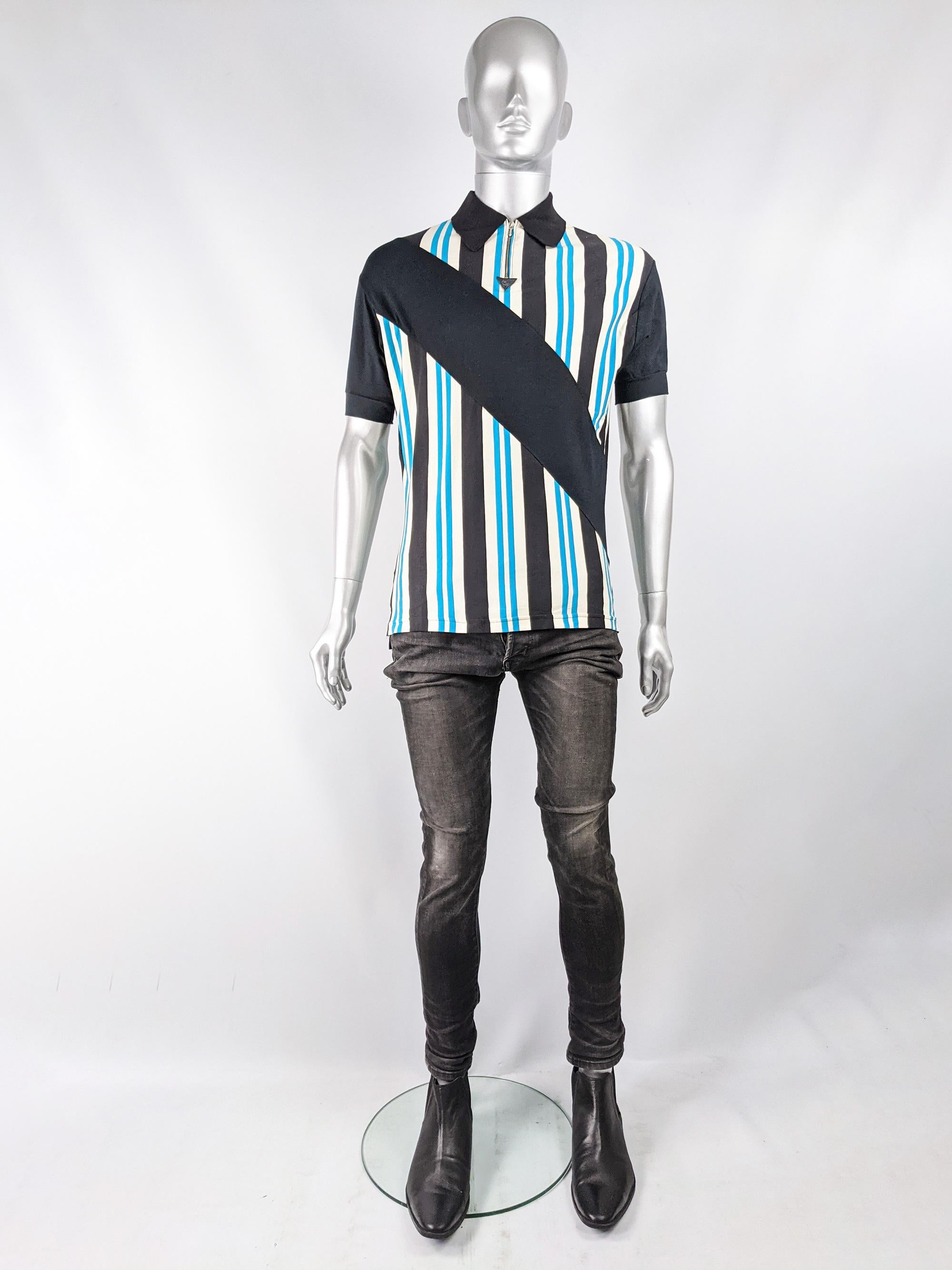An amazing and rare vintage John Richmond mens shirt for the Destroy line. In a blue, cream and black cotton and lycra jersey with a zip up collar and a bold stripe diagonal across the chest. 

Size: Marked M
Chest - 42” / 106cm 
Waist - 34” /