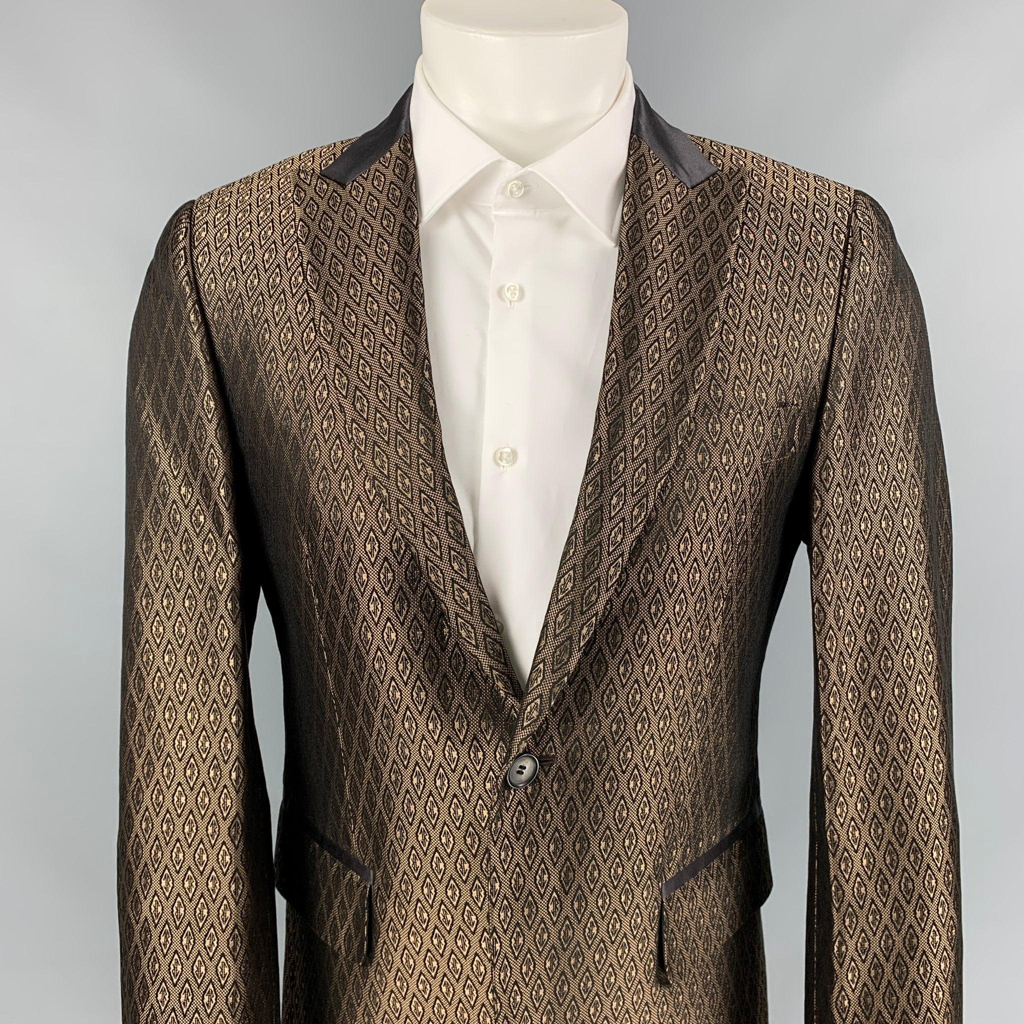 JOHN RICHMOND sport coat comes in a brown jacquard cotton / silk with a full liner featuring a peak lapel, single back vent, flap pockets, and a single button closure. Made in Italy.
Very Good
Pre-Owned Condition. 

Marked:   Size tag removed. 