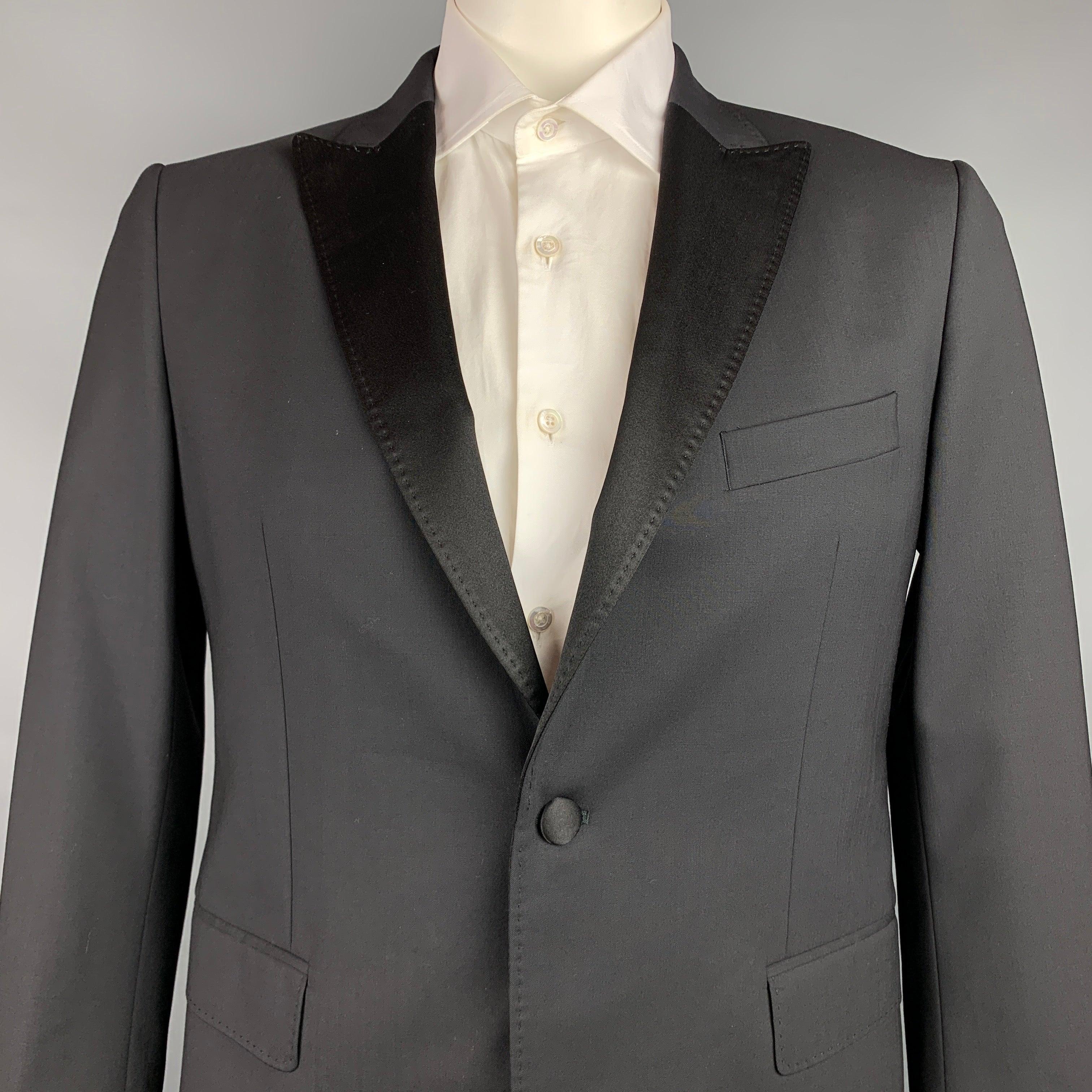 JOHN RICHMOND
sport coat comes in a black wool with a full liner featuring a peak lapel, flap pockets, beaded back design, and a single button closure. Made in USA.Very Good Pre-Owned Condition. 

Marked:   52 

Measurements: 
 
Shoulder: 18 inches 