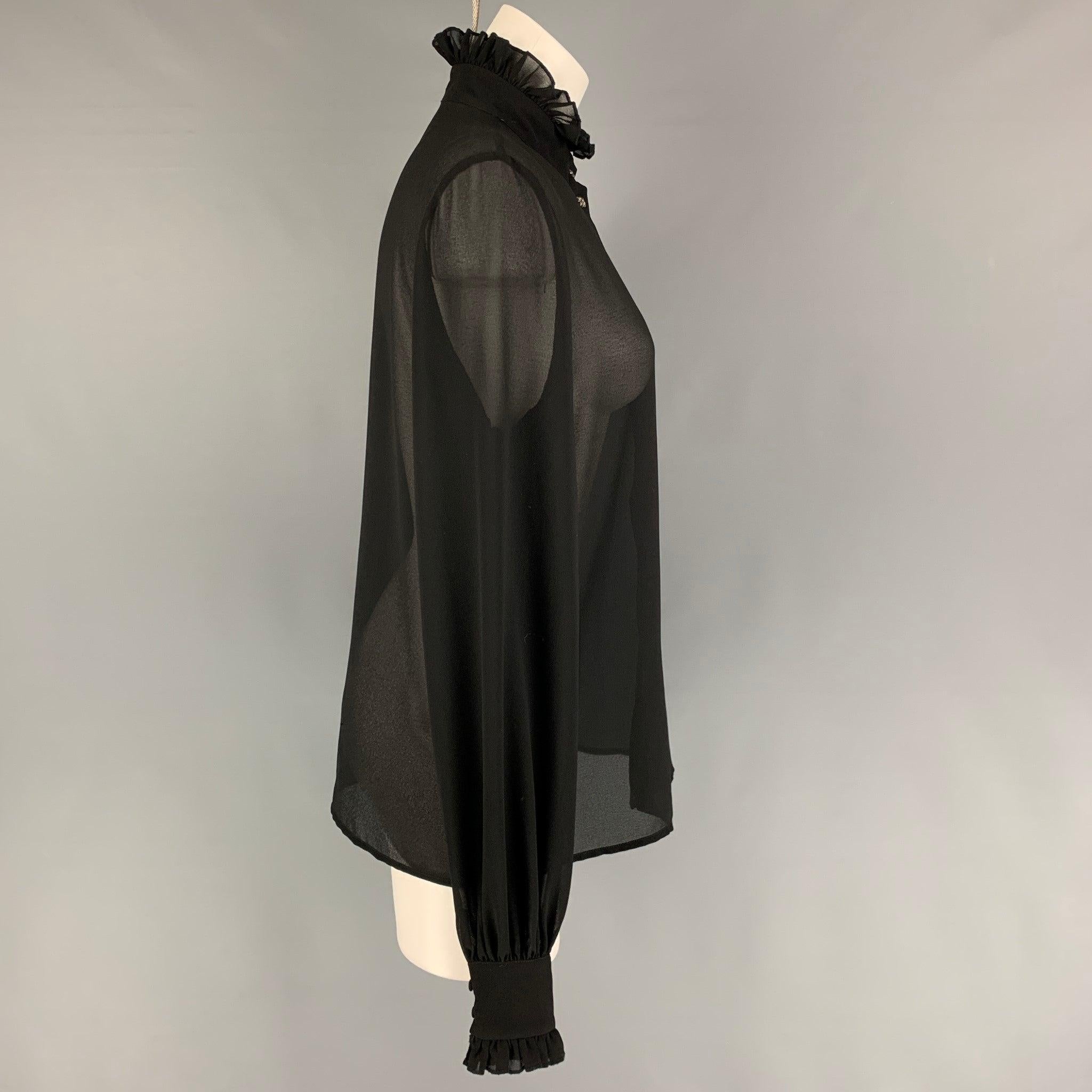 JOHN RICHMOND blouse in a black polyester featuring a high collar and a silver tone snap button closure.
Excellent Pre-Owned Condition. 

Marked:   42 

Measurements: 
 
Shoulder: 15.5 inches  Bust:
38 inches 
Sleeve: 28.5 inches  Length: 25 inches