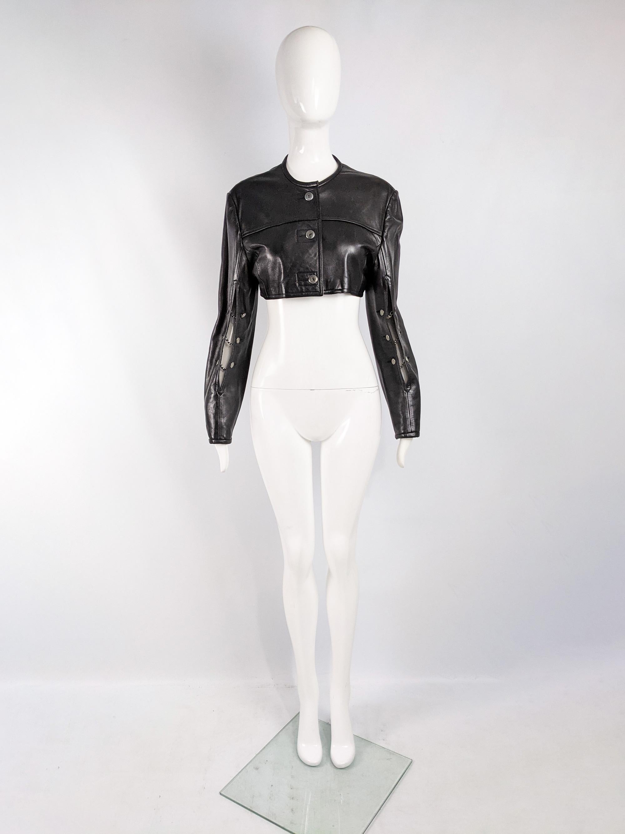 An ultra chic vintage womens John Richmond cropped leather jacket from the 90s in a black leather with open cut out details on the sleeves with chains in between giving a futuristic, minimalist look. 

Size: Marked vintage UK 12 but measures more