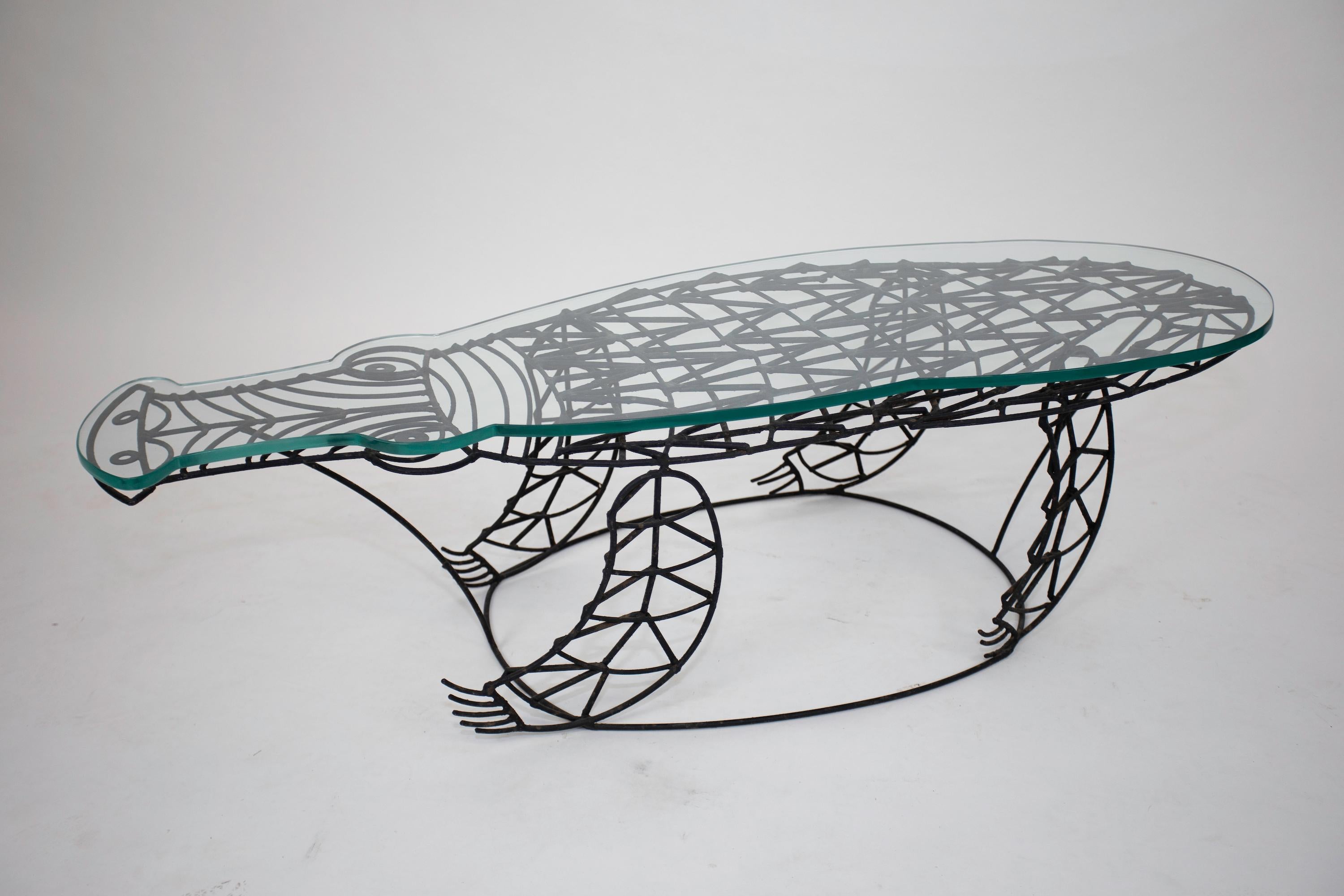 John Risley Alligator Table with conforming Glass Top
Original surface on the wrought Iron.