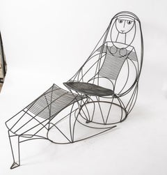 Silla de salón y otomana John Risley