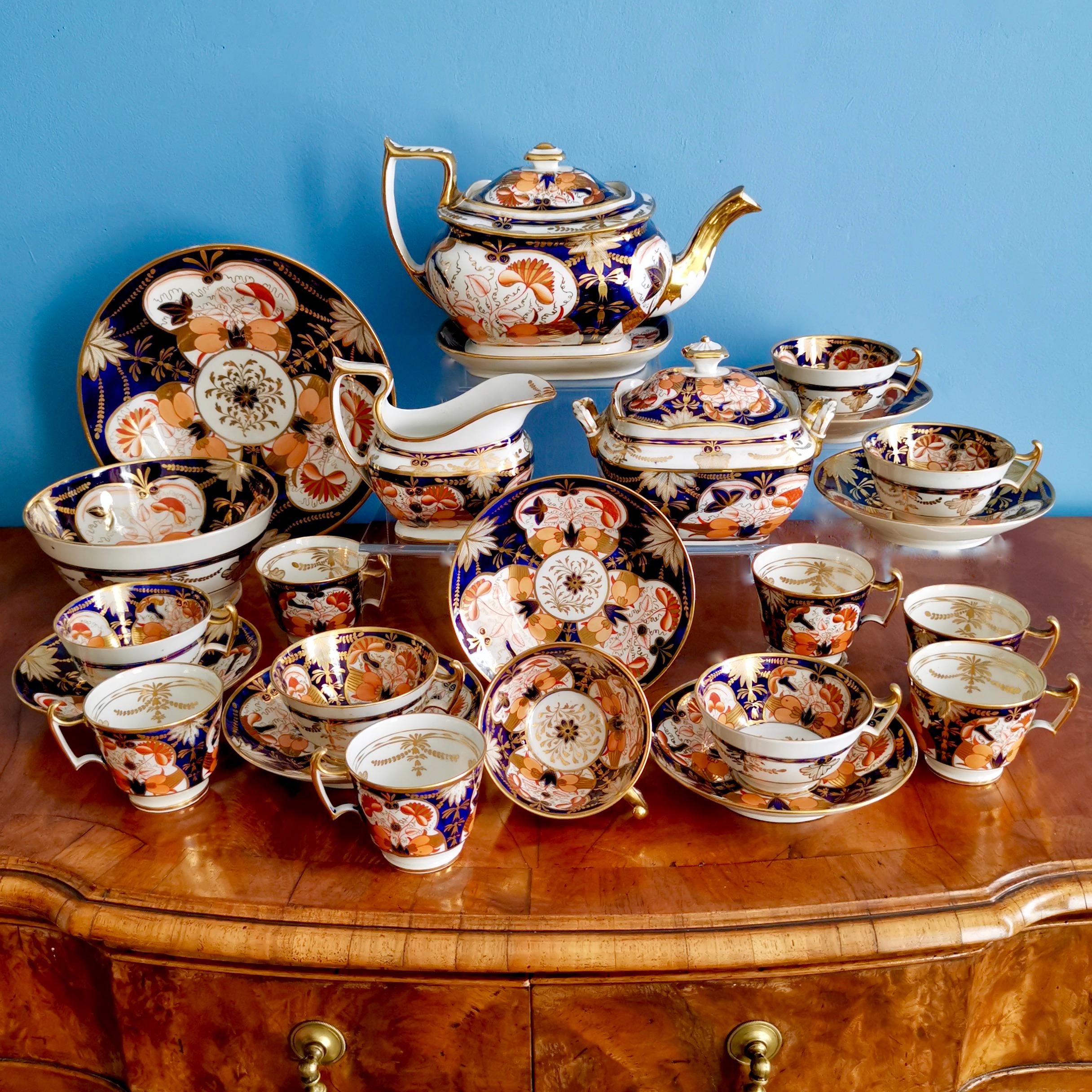 This is a stunning tea service made by John Rose / Coalport in circa 1815, which was the Regency era. It is decorated in a bright Imari design and is in excellent condition. It consists of a teapot on a stand, a milk jug, a lidded sucrier, a slop
