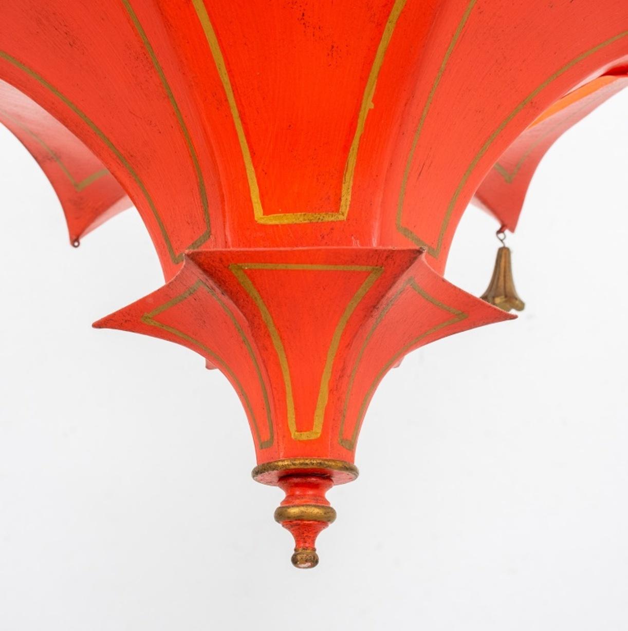 John Rosselli Chinoiserie pagoda pendant uplight in the form of an inverted two-tiered tiered pagoda roof, decorated in coral red with gilt decoration, with pendant tassels (one lacking).

Dimensions: 16