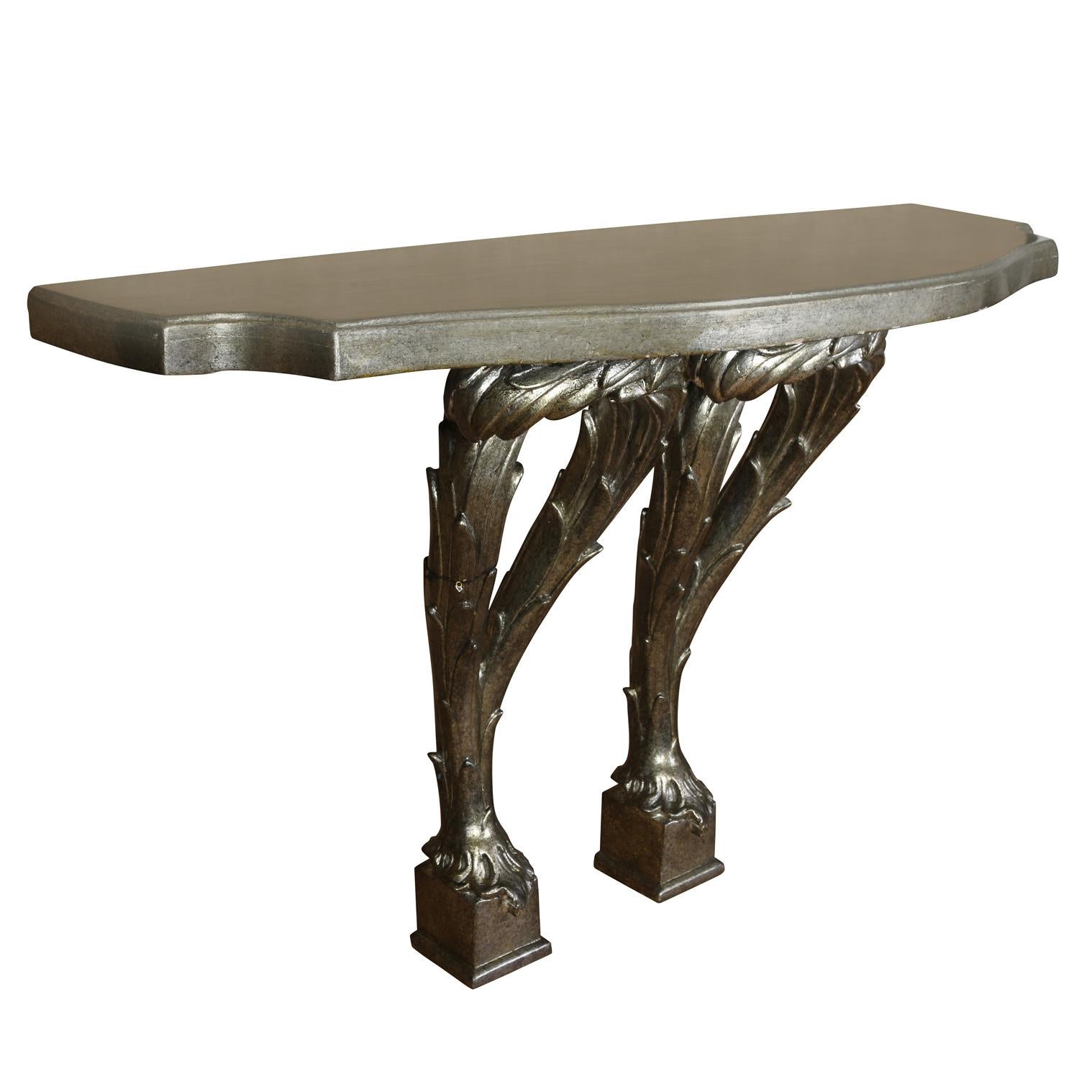 A vintage John Rosselli silver leaf console table in Serge Roche style with a double pedestal.