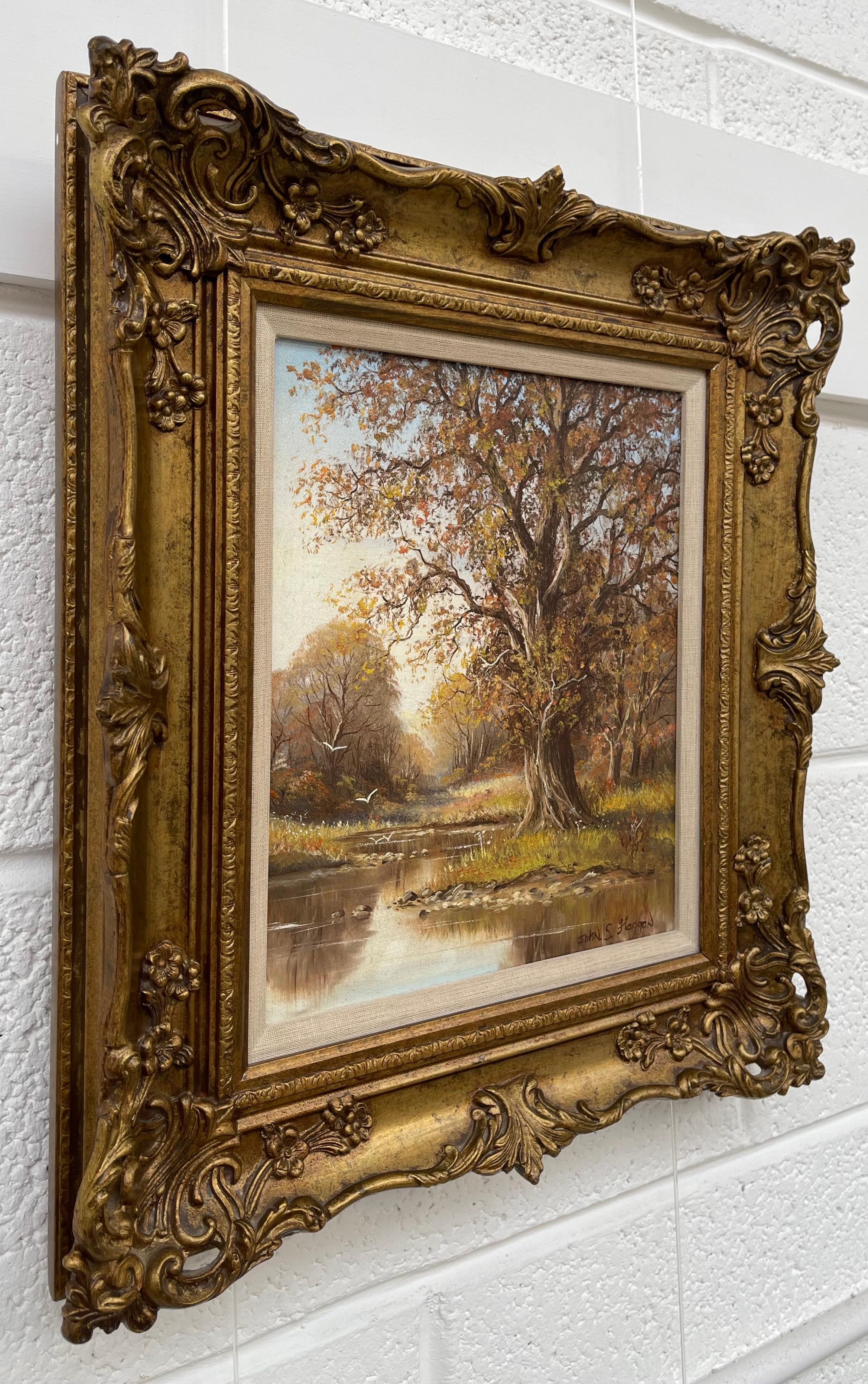 Alberi autunnali lungo il fiume nella contea di Tyrone, opera di un artista irlandese moderno del XX secolo - Painting di John S Haggan