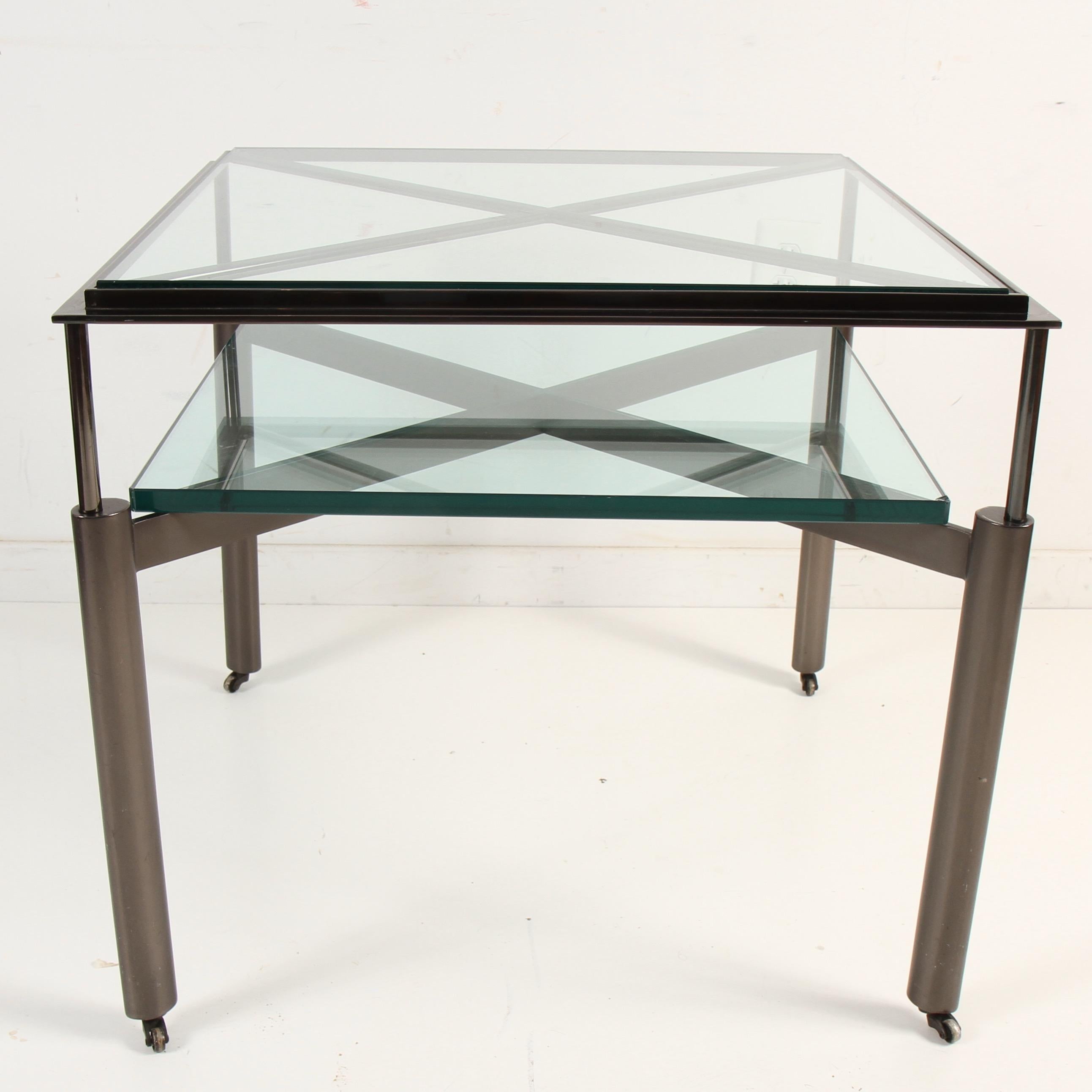 Square form with inset beveled glass top over sophisticated 