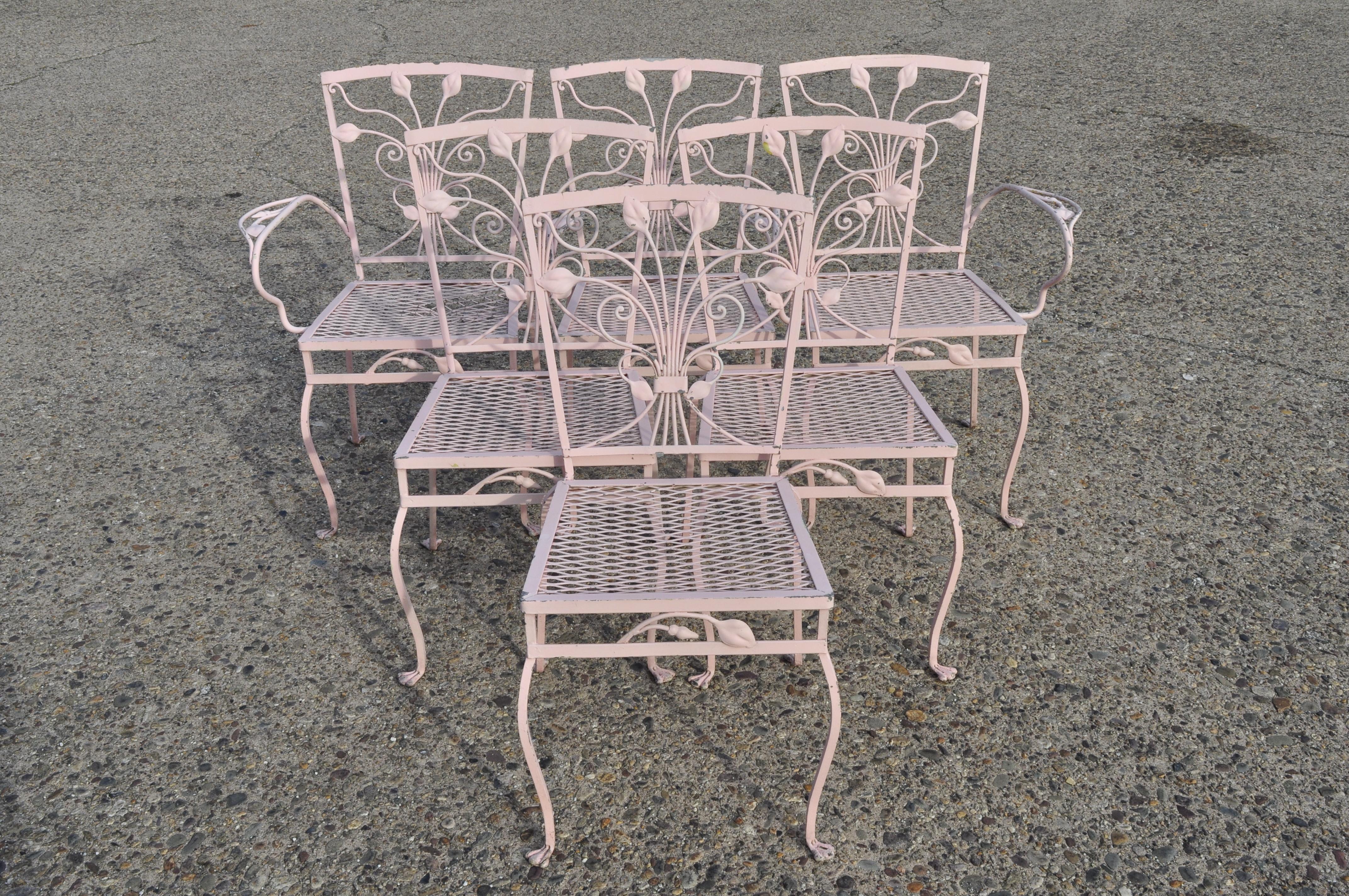 Vintage John Salterini 7 piece flower leaf scrollwork patio garden wrought iron dining patio set. Listing includes (4) side chairs, (2) arm chairs, large rectangular table with umbrella hole, no glass top, heavy thick gauge wrought iron